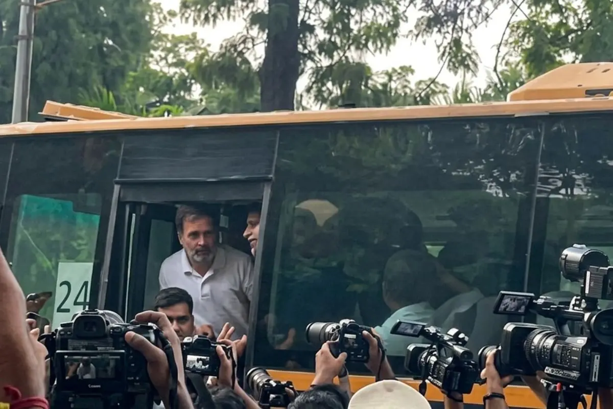 Rahul Gandhi looks out from a police vehicle after being detained during the Congress protest near the Prime Minister's residence in New Delhi on Tuesday over the alleged NEET-UG 2026 paper leak.