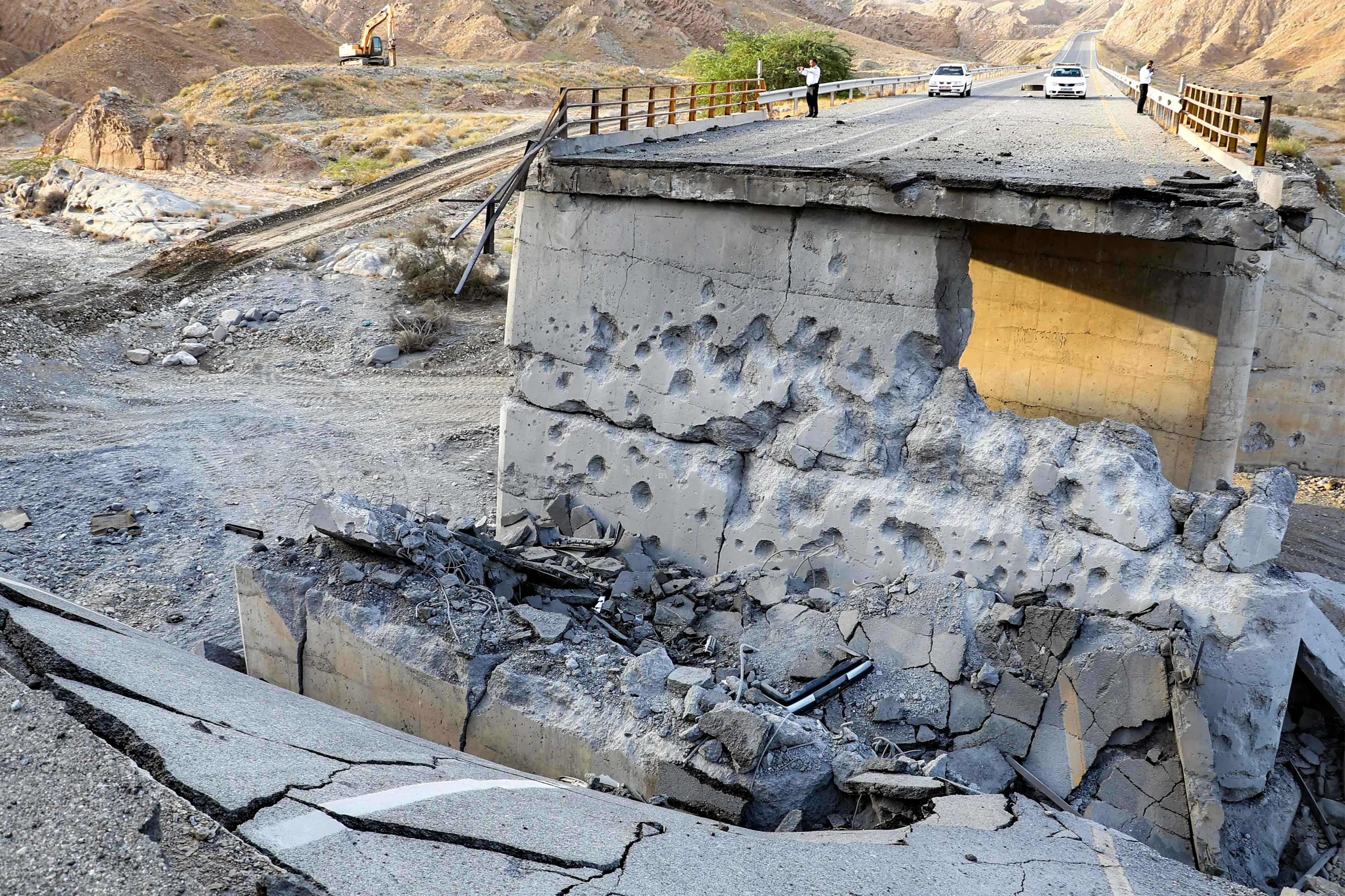 A heavily damaged bridge which was hit by a US strike is pictured along the road connecting Roudan and Bandar Abbas in southern Iran | AFP
