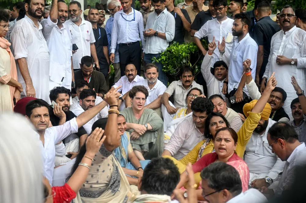 Opposition leaders of the Congress Rahul Gandhi and his sister Priyanka Gandhi Vadra stage a sit-in protest calling for Prime Minister Narendra Modi's resignation outside the latter's residence in New Delhi | AFP