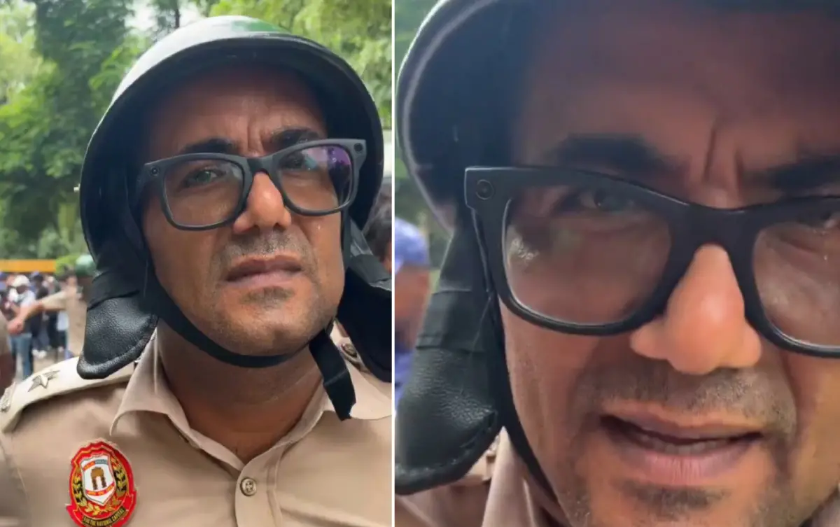 സിജെപി സമരത്തിനിടെ മെറ്റ ഗ്ലാസ് ധരിച്ചെത്തിയ അഡീഷണൽ ഡെപ്യൂട്ടി കമ്മീഷണർ സന്ദീപ് ലാംബ | Photo: Screenshot