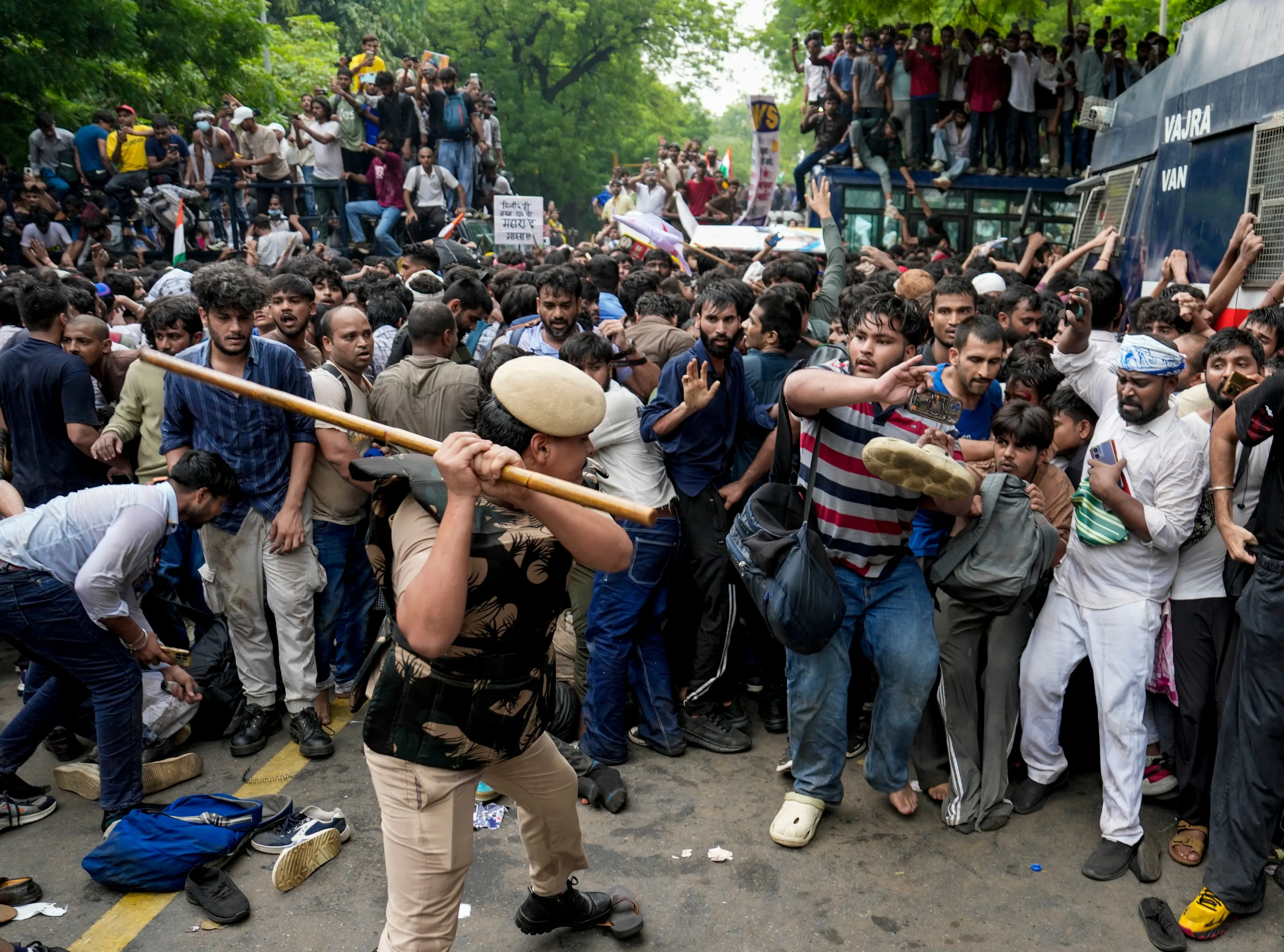 Security personnel stop Cockroach Janata Party (CJP) supporters as they raise slogans during a protest march, at Sansad Marg, in New Delhi, Monday, July 20, 2026.| Photo: PTI