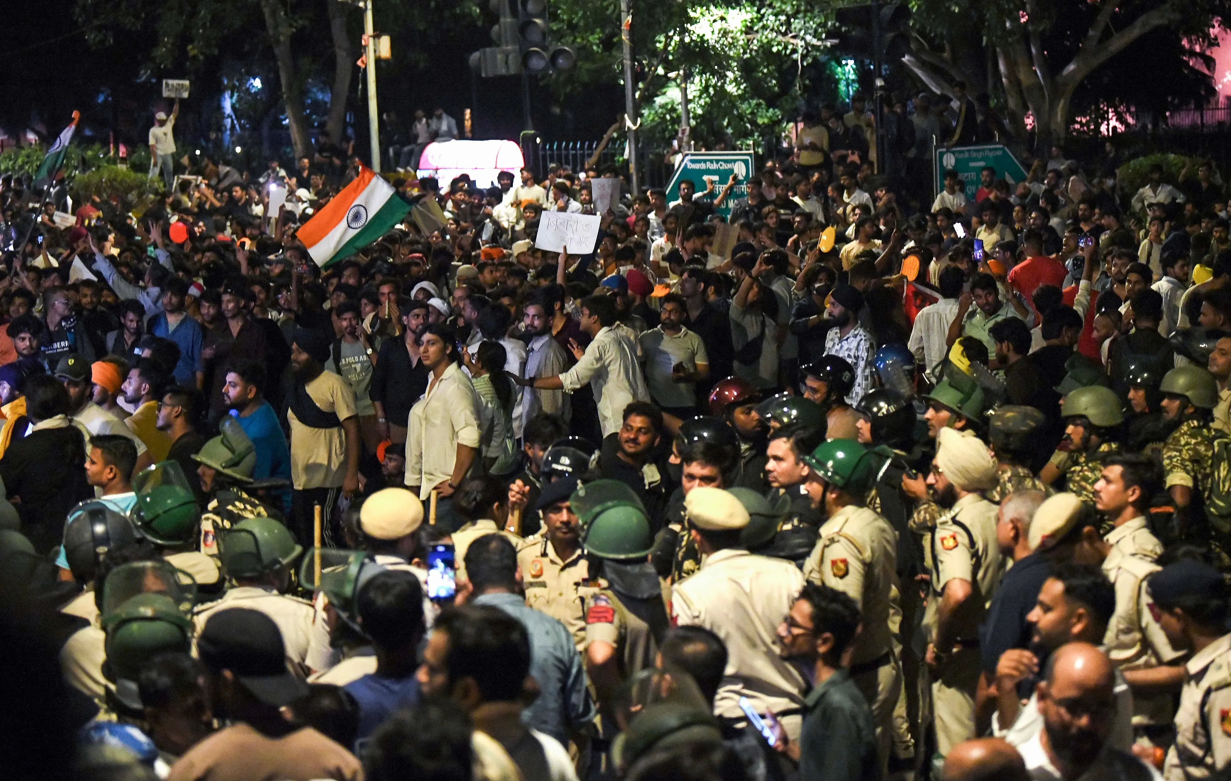 Heavy police force deployed as protesters in large numbers continue their protest in support of the Cockroach Janata Party (CJP), demanding the resignation of Union Education Minister Dharmendra Pradhan over alleged examination irregularities and NEET paper leak, near Jantar Mantar in New Delhi.| Photo: ANI