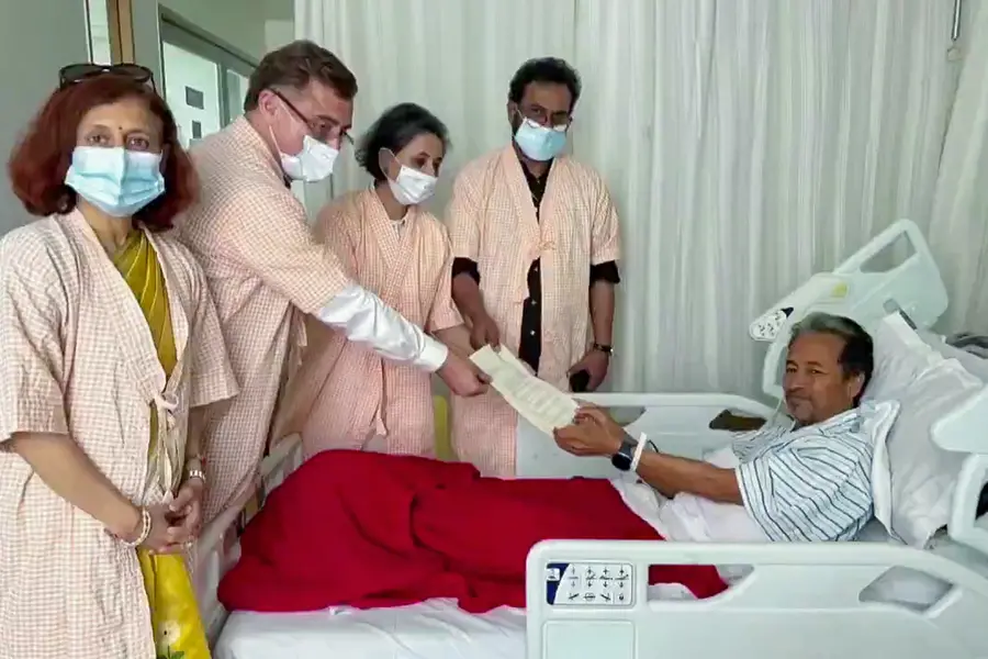 Environmentalist Sonam Wangchuk collects a document as he receives written assurances of parliamentary discussion on the alleged NEET paper leak