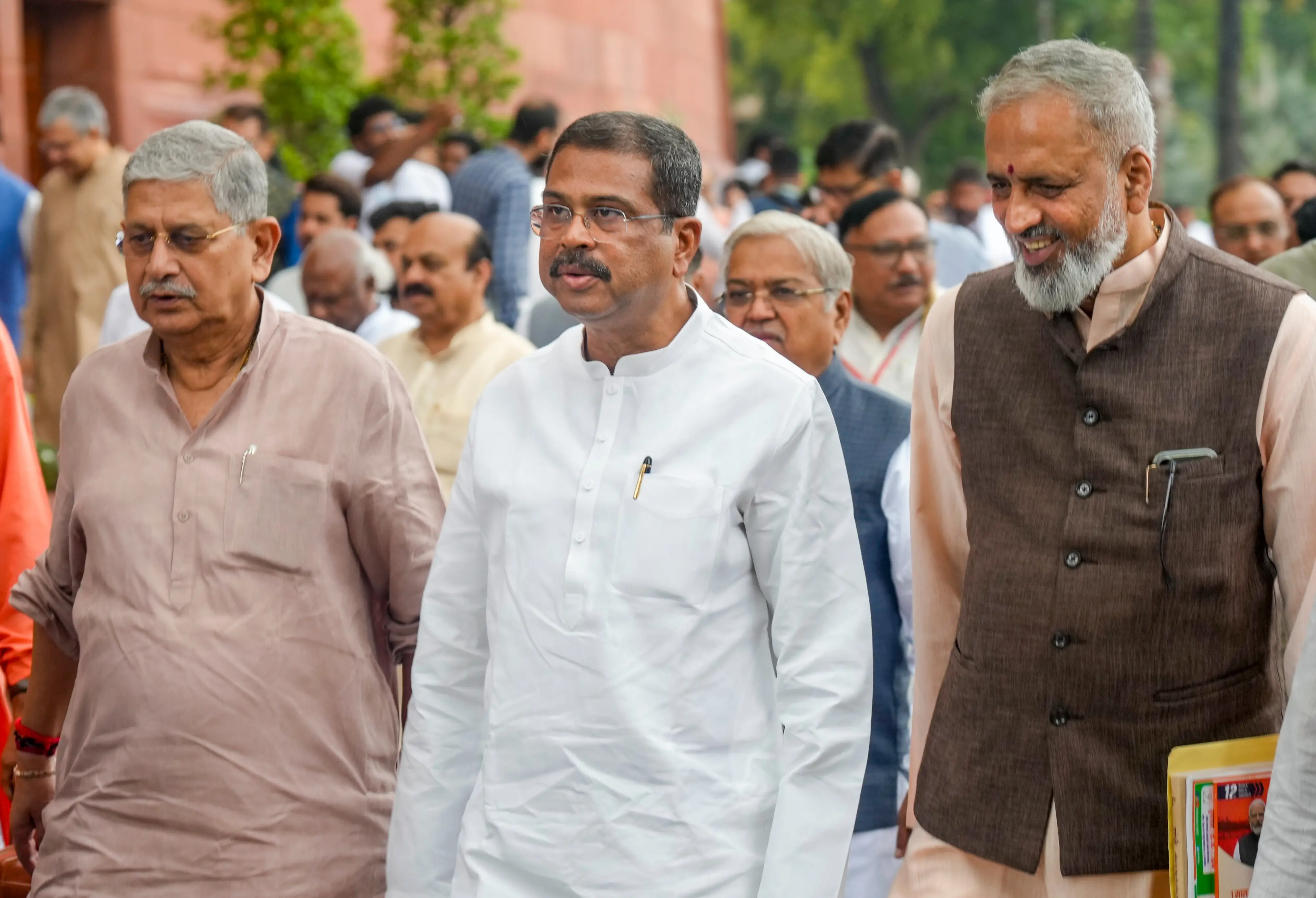 Former Union Education Minister Dharmendra Pradhan along with Union Fisheries, Animal Husbandry and Dairying and Panchayati Raj Minister Rajiv Ranjan Singh and BJP MP Vishweshwar Hegde Kageri during the Monsoon Session of the Parliament, in New Delhi.| File image: PTI