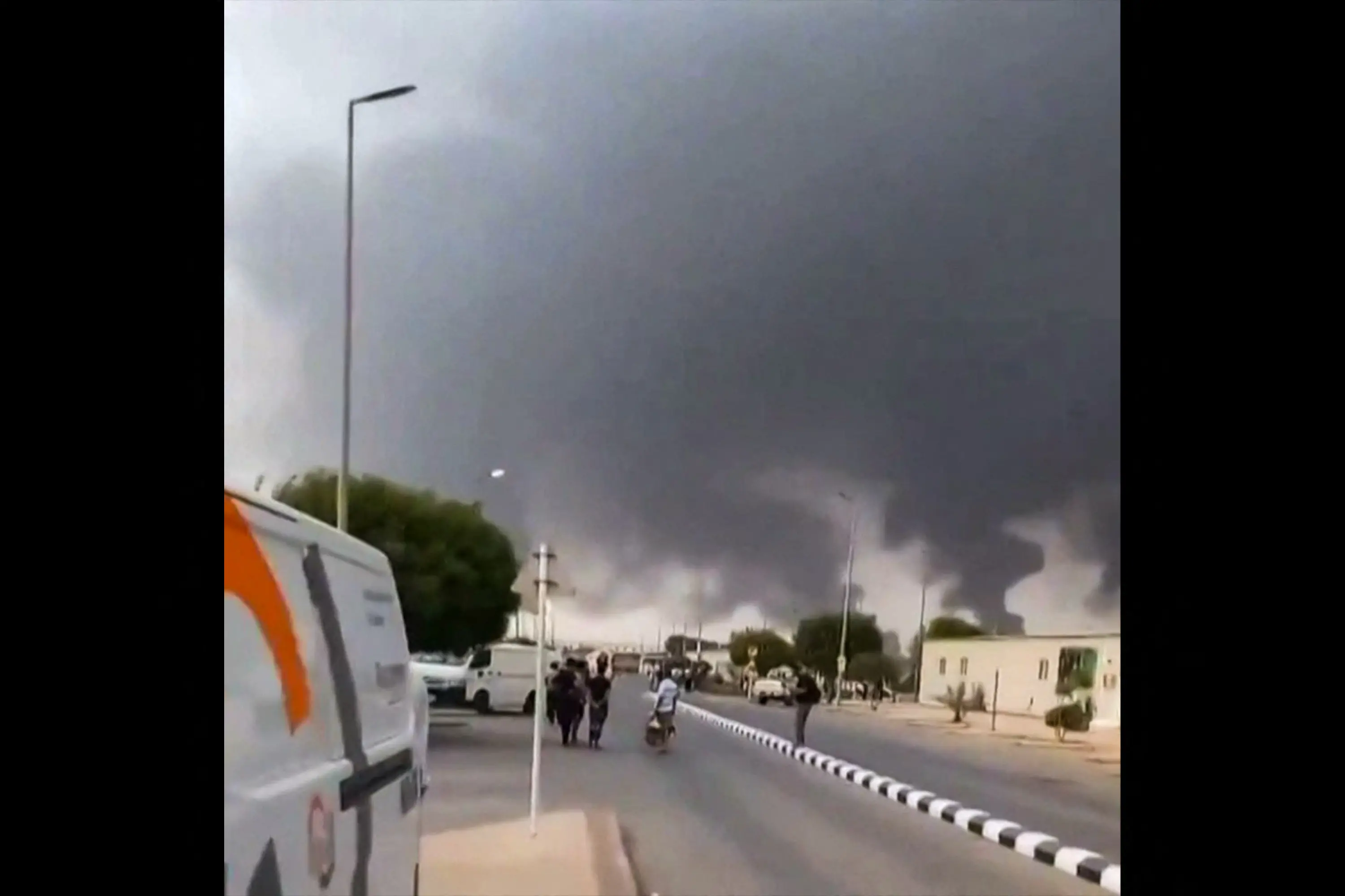 This screen grab taken on July 25, 2026 from an undated UGC video footage posted on social media and verified by AFPTV teams shows clouds of smoke rising after strikes on the Saudi Aramco refinery in Jizan. | Photo: AFP