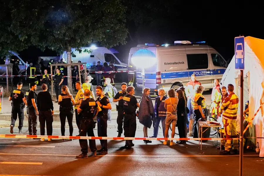 Emergency personnel and police gather in Berlin, early Sunday, July 26, 2026, following the cancellation of Christopher Street Day festivities