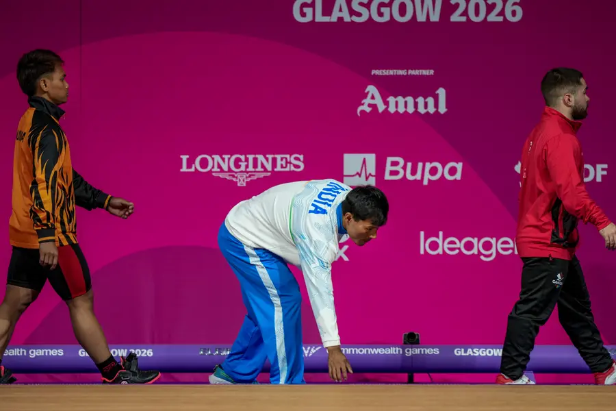 Rishikanta Singh, centre, competes in the men's 60 kg Weightlifting event at the Commonwealth Games 2026