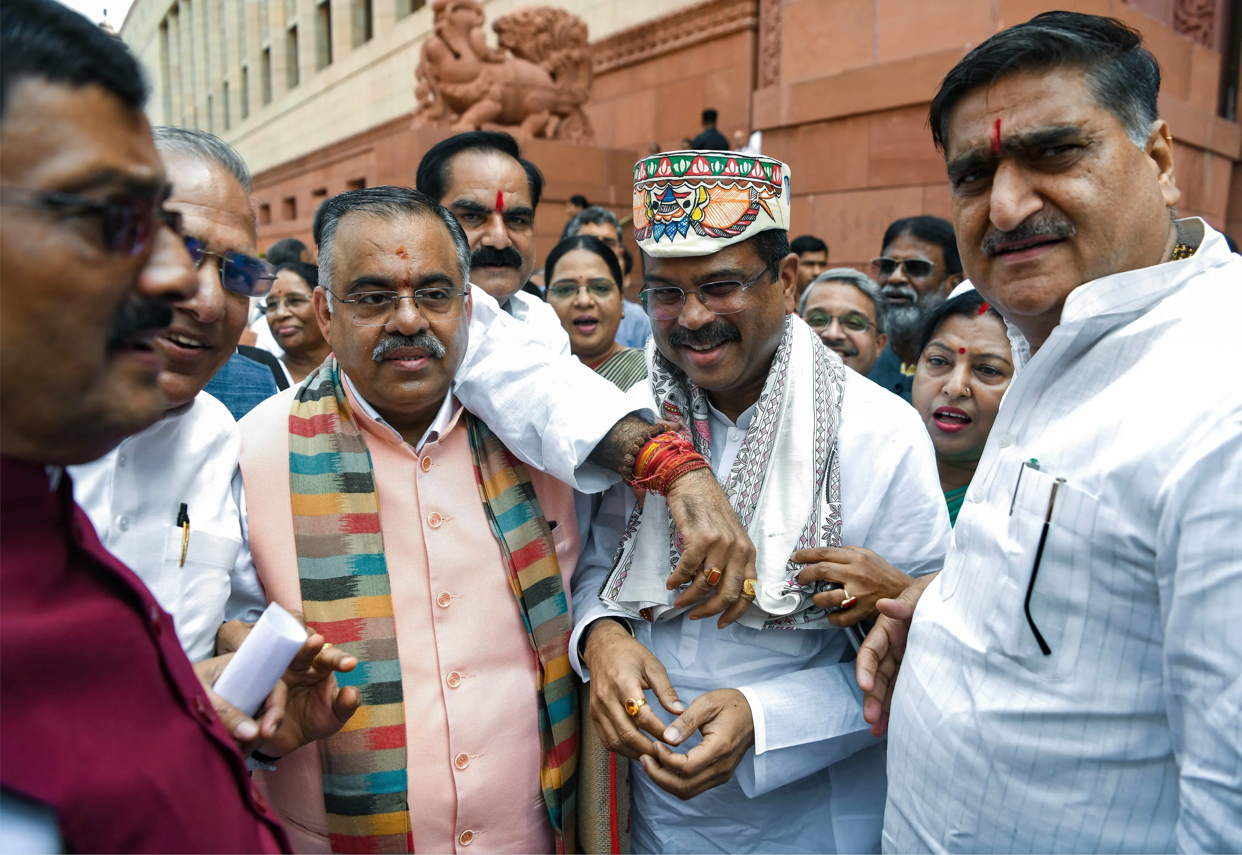 Former Union Education Minister and BJP MP Dharmendra Pradhan arrives at Parliament as BJP-NDA MPs welcome him during the Monsoon Session, in New Delhi.| Photo: ANI