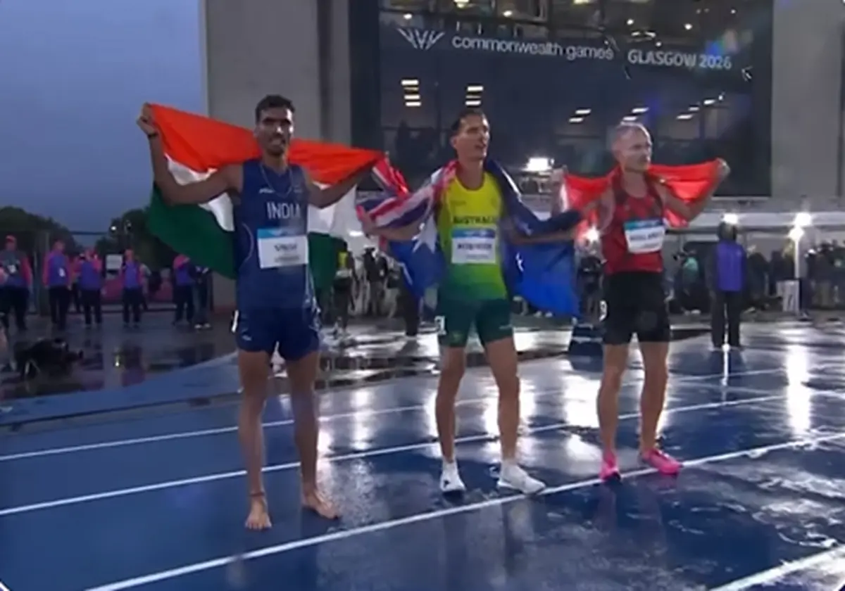 Silver medallist India's Gulveer Singh celebrate after competing the men's 10,000m final during the athletics event at the Scotstoun Stadium in Glasgow