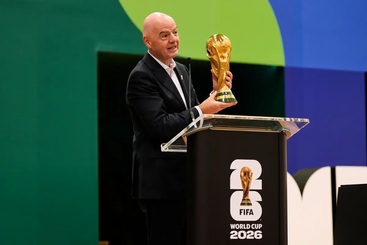 File: FIFA President Gianni Infantino holds the World Cup trophy | Photo: AP