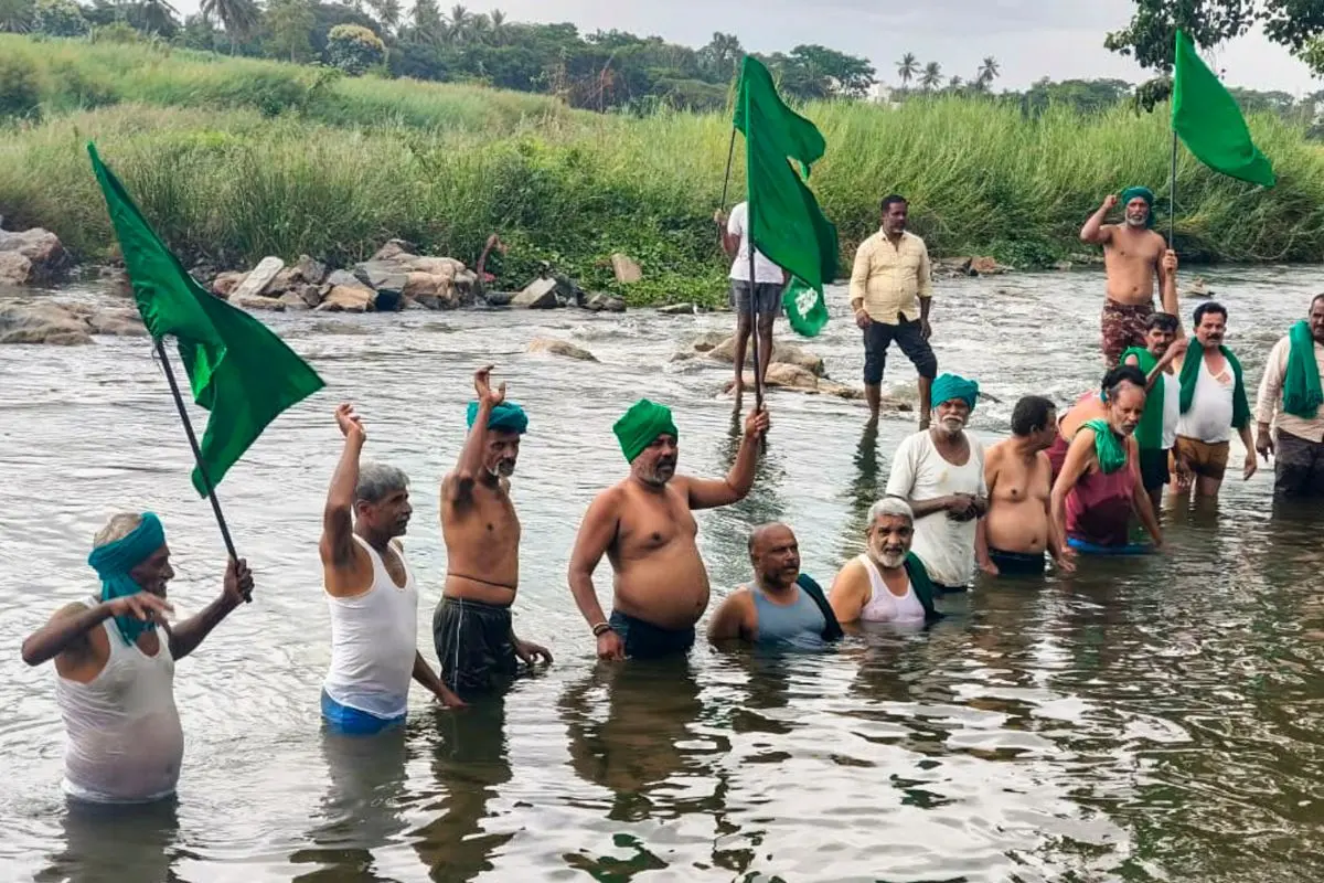 People stage a protest over the CWMA upholding the CWRC order to release 3,500 cusecs of Cauvery water daily to Tamil Nadu for the next 15 days, in Mandya, Karnataka, Thursday, July 30, 2026. (PTI Photo)