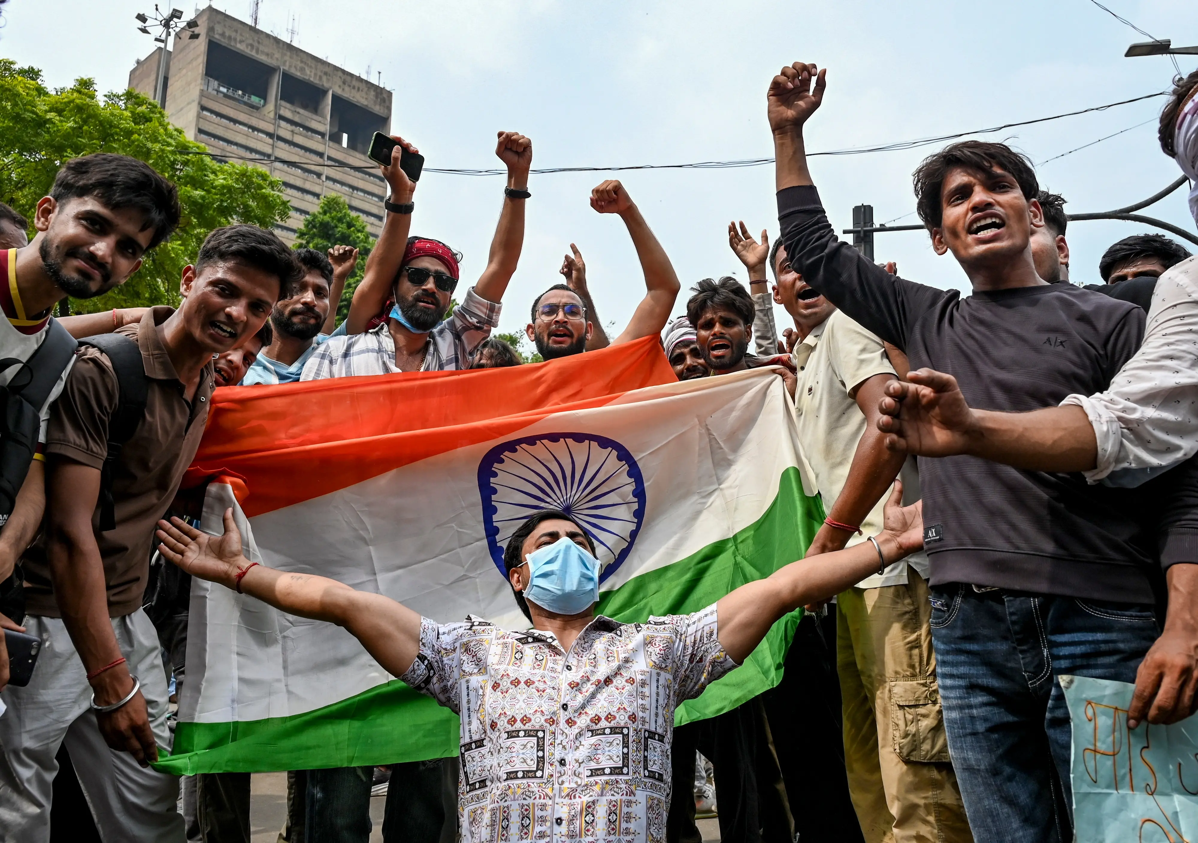 People celebrate after Union Education Minister Dharmendra Pradhan resigned and took responsibility for the NEET paper leak, at Jantar Mantar in New Delhi.| Photo: PTI