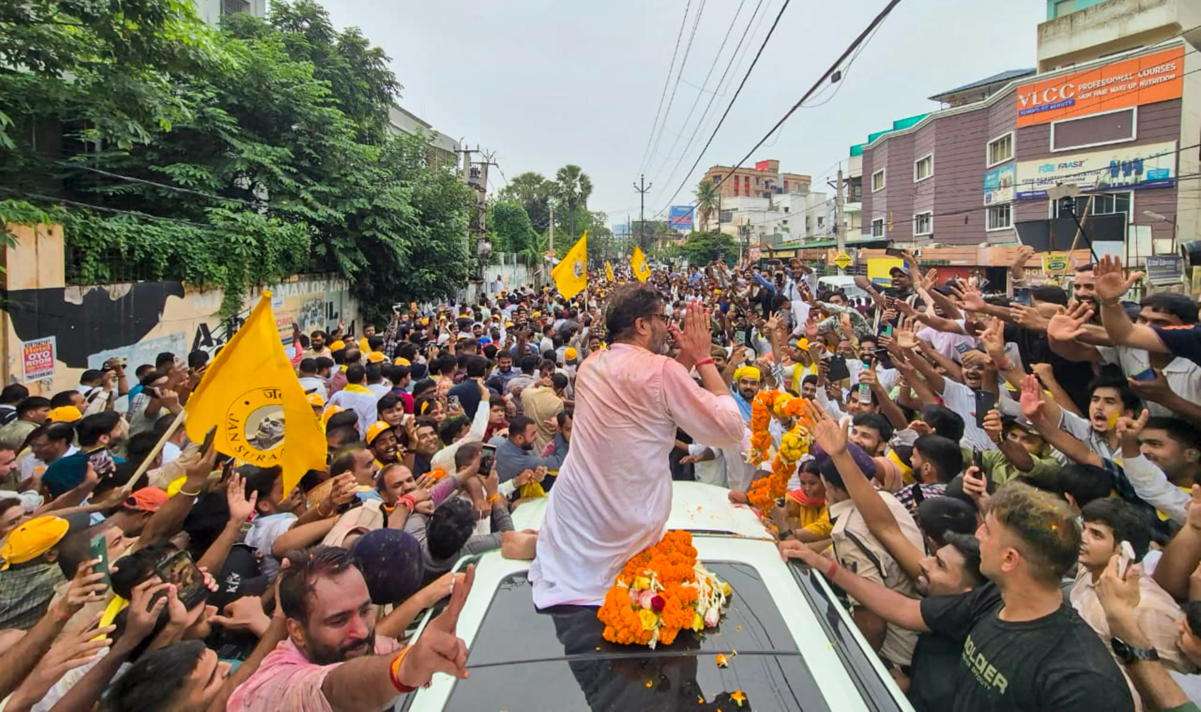 Jan Suraaj Party chief Prashant Kishor celebrates with supporters after taking the lead in the Bankipur Assembly by-election during the counting of votes, in Patna, Bihar.