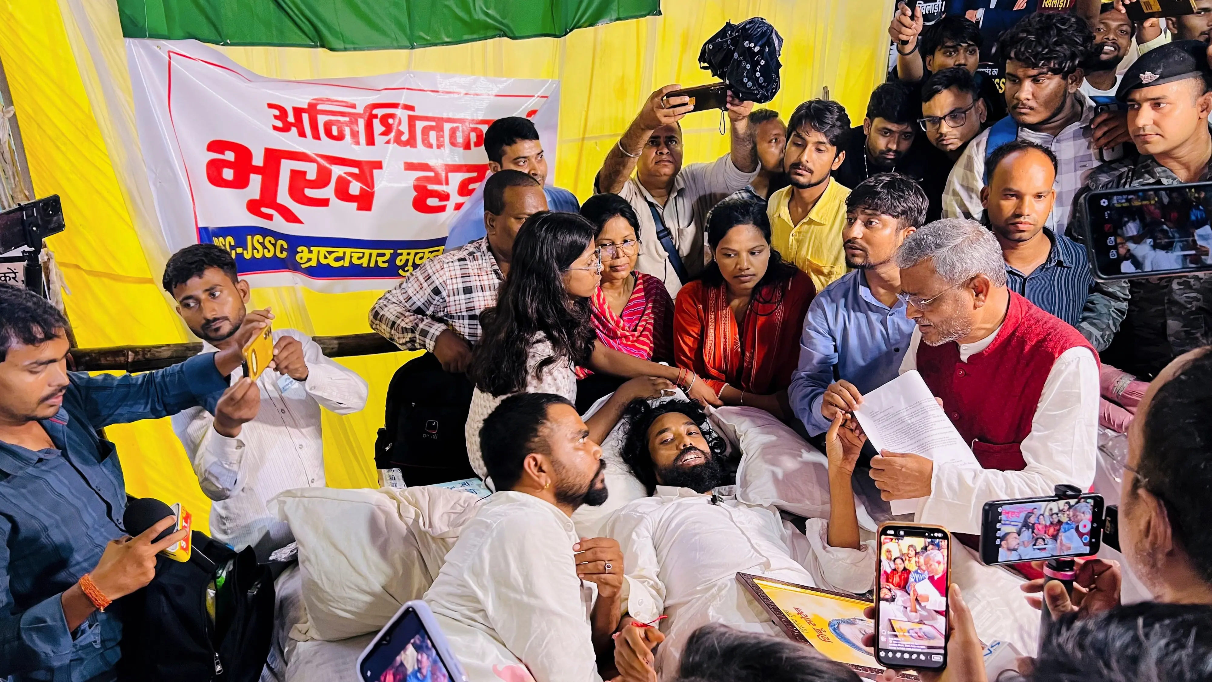 Leader of Opposition in the Jharkhand Legislative Assembly and BJP leader Babulal Marandi interacts with student leader Devendra Nath Mahato and other protesters staging an indefinite hunger strike against alleged paper leaks | PTI
