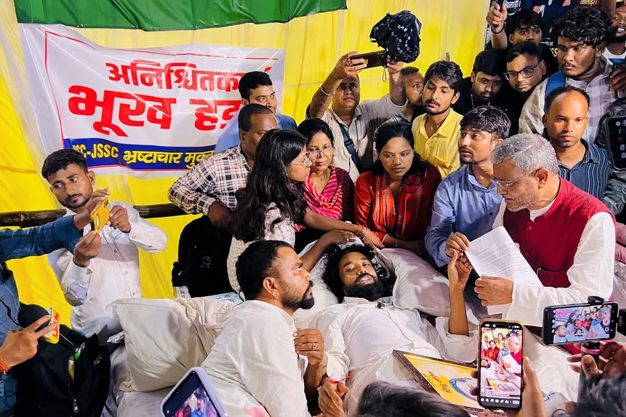 Leader of Opposition in the Jharkhand Legislative Assembly and BJP leader Babulal Marandi interacts with student leader Devendra Nath Mahato and other protesters staging an indefinite hunger strike against alleged paper leaks | PTI