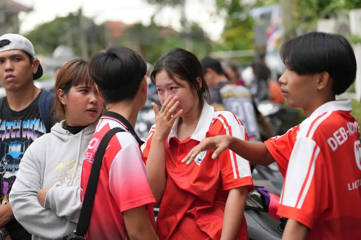 A schoolgirl cries outside her school where deaths and injuries were reported after a shooting in Thailand's Nonthaburi province, Friday, Aug. 7, 2026. (AP/PTI)