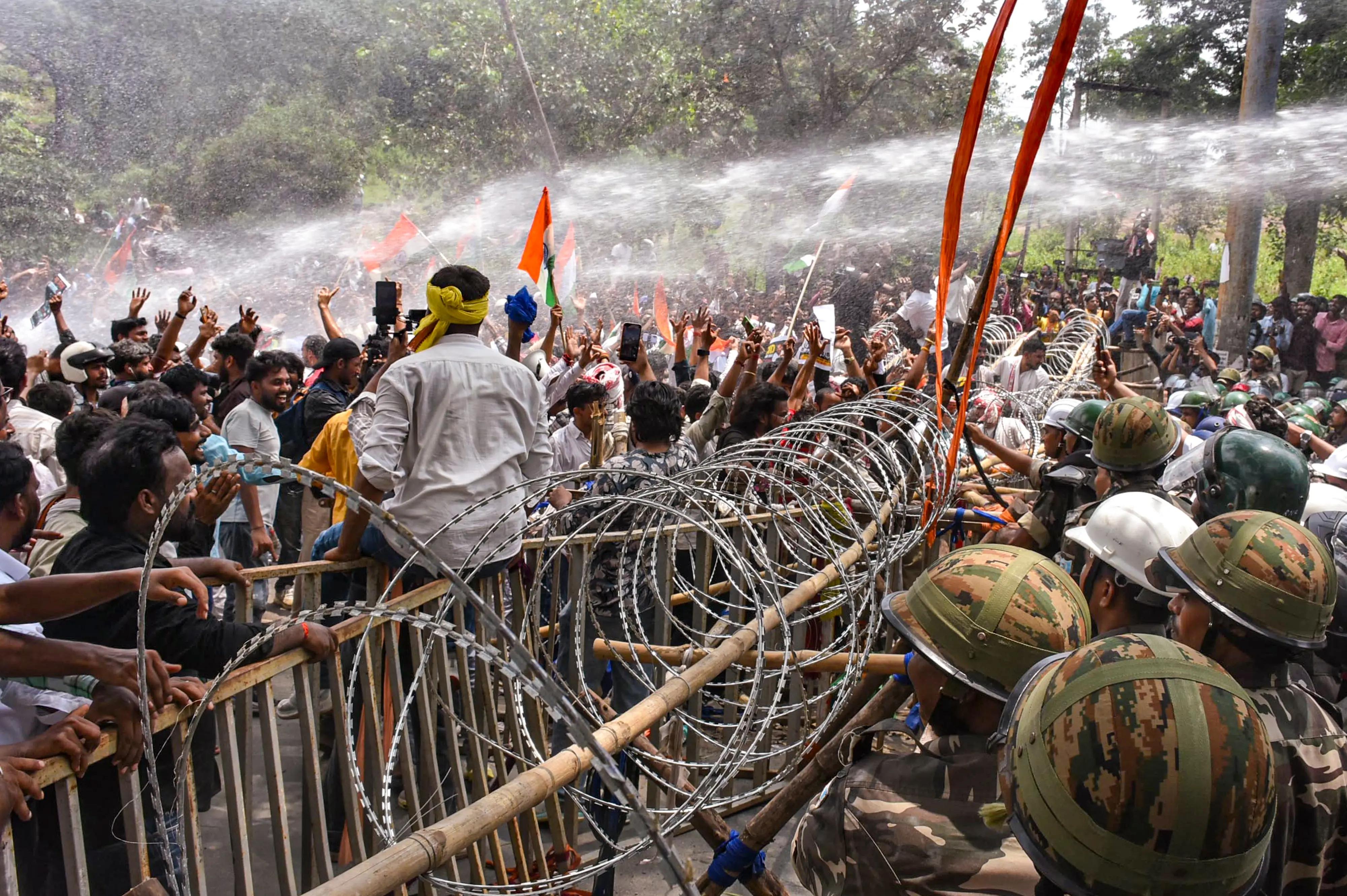 Water conons being used on people marching towards Jharkhand Assembly amid a protest over alleged irregularities in the 14th JPSC examination, JSSC-CGL and other recruitment tests, demanding resignation of Jharkhand Chief Minister Hemant Soren and CBI probe on paper leaks, in Ranchi
