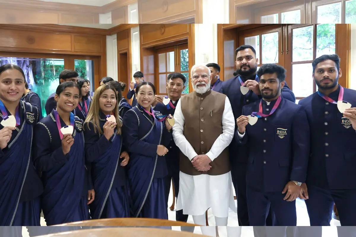 Prime Minister Narendra Modi with weightlifter Saikhom Mirabai Chanu, Bindyarani Devi and other medalists during a felicitation ceremony for India's Glasgow 2026 Commonwealth Games contingent at the Prime Minister's residence in New Delhi. (PMO via PTI Photo)