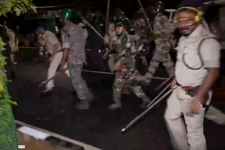 Security personnel disperse student protesters during a lathi-charge outside the Jharkhand Legislative Assembly's Gate No. 1