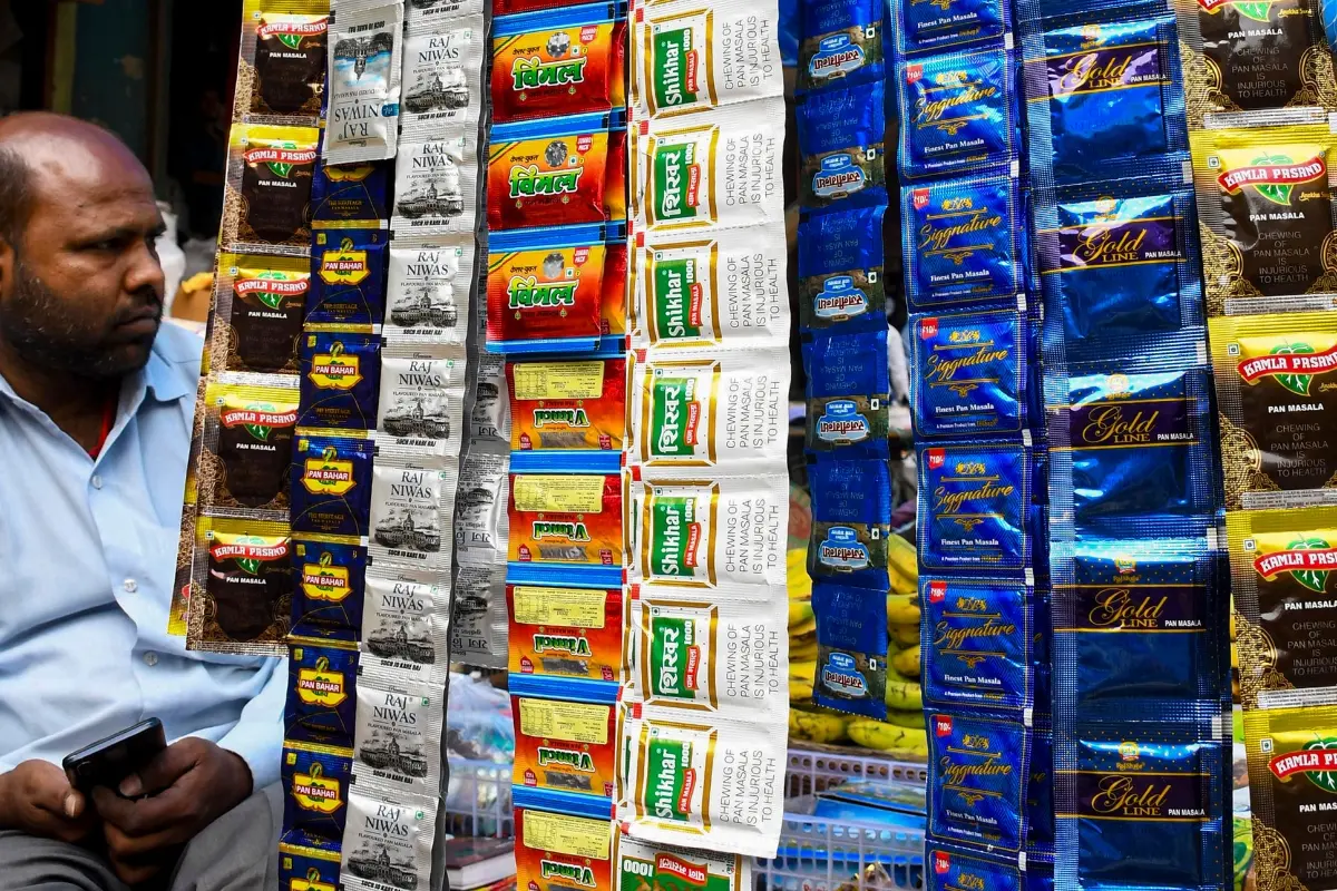 Tobacco and pan masala sachets hang on display at a roadside shop, following the presentation of the Union Budget 2026-27, in Guwahati.| File image: PTI