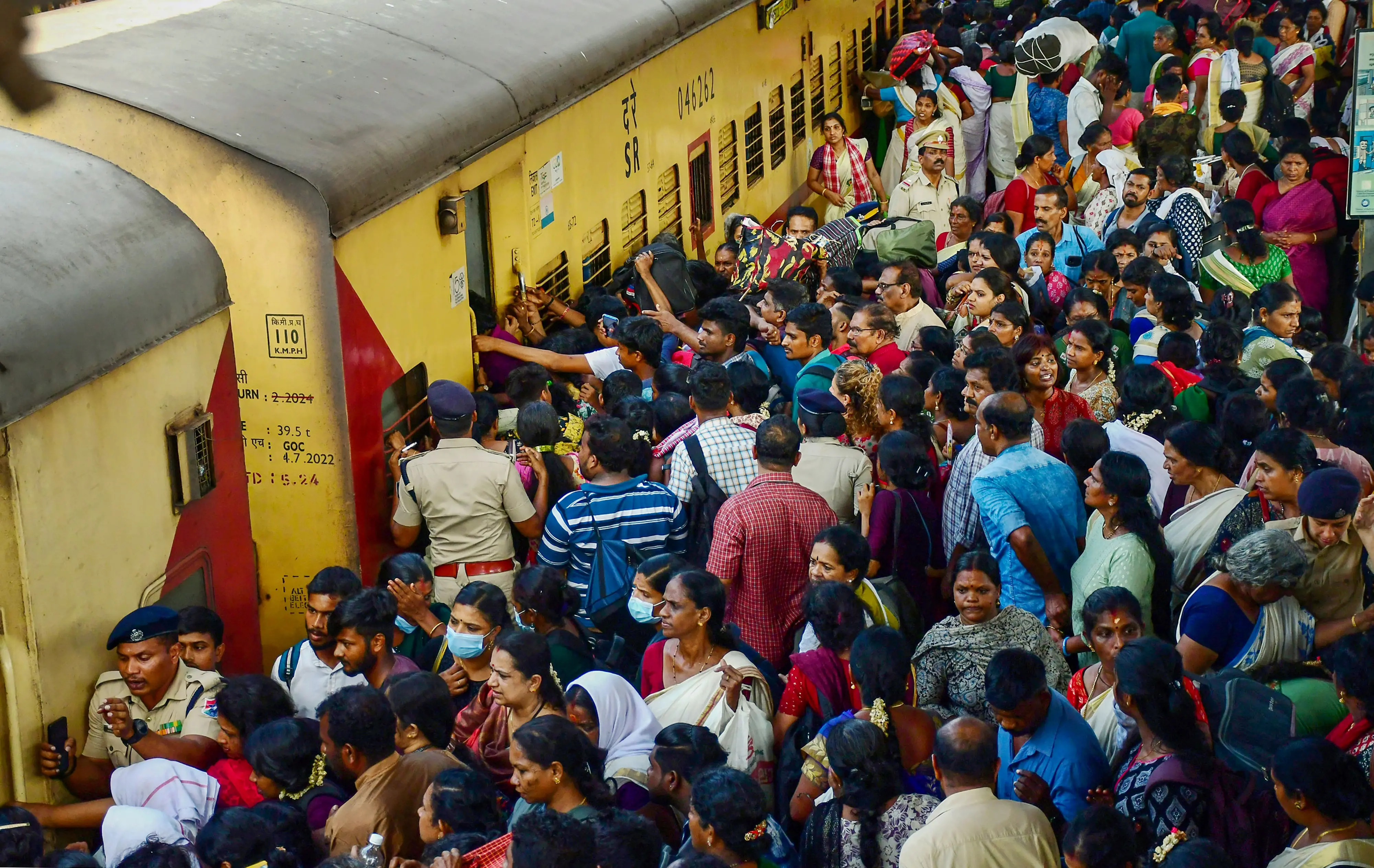 People board a train at the central railway station in Thiruvananthapuram.| File image: PTI