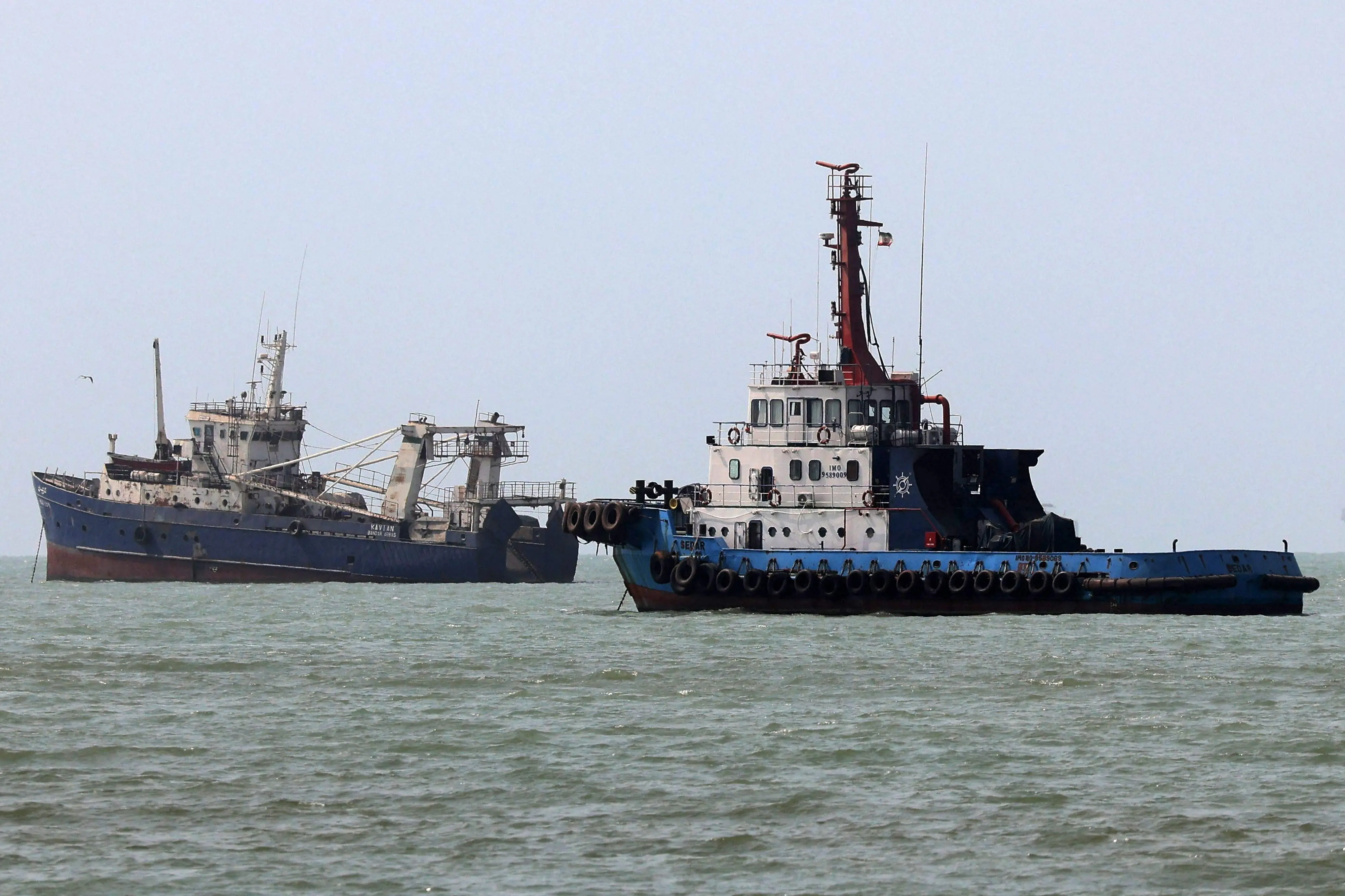 Vessels transit the Strait of Hormuz off Bandar Abbas in southern Iran.| Photo: AFP