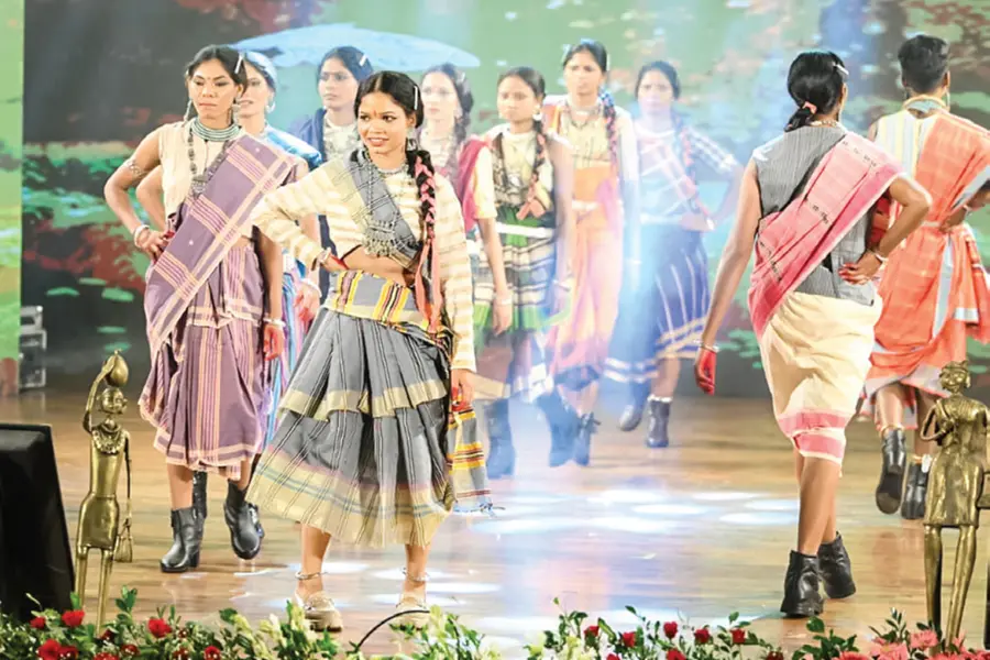 Surrendered women Maoists wearing traditional Khadi and Kosa sarees walking the fashion runway in Raipur