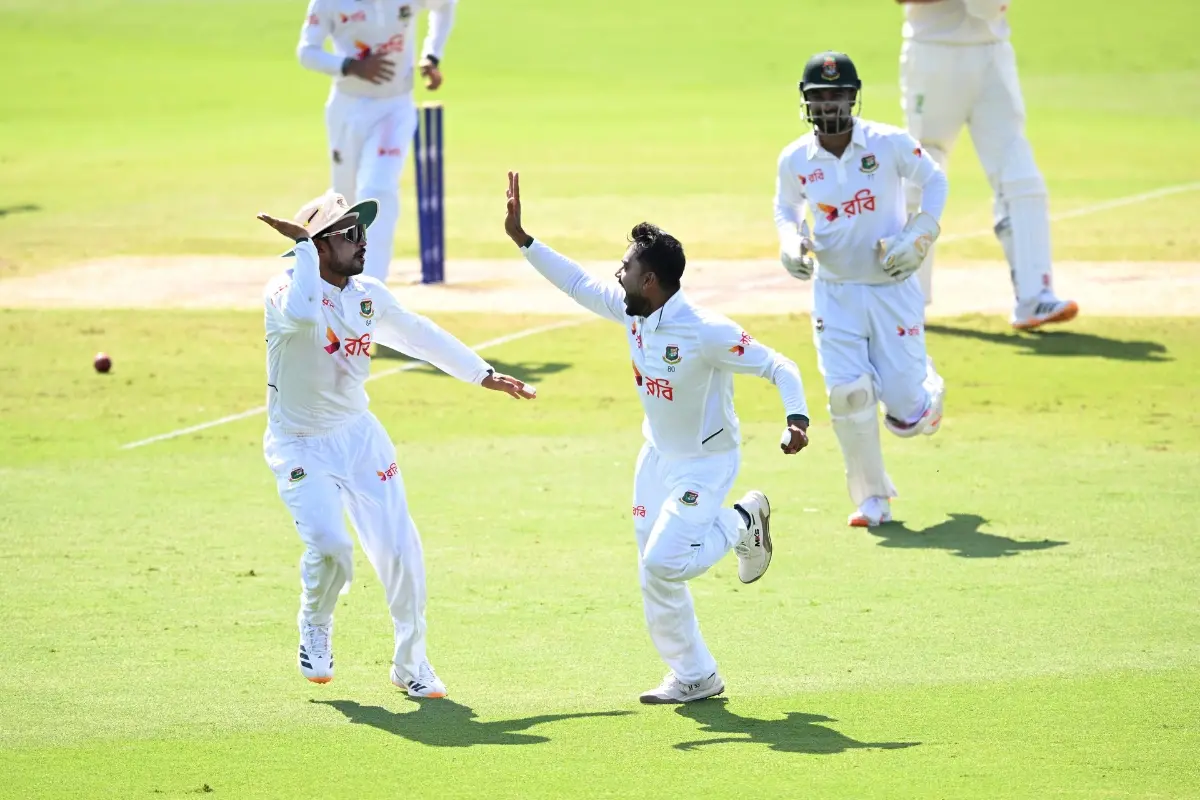 Mehidy Hasan Miraz, center, of Bangladesh celebrates with teammates after dismissing Beau Webster of Australia during play on day four of the first cricket test in Darwin | Photo: AP/PTI
