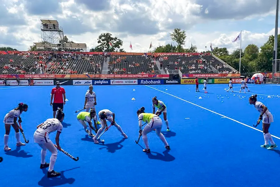 Members of the Indian women's hockey team, including defender Ishika Chaudhary, jersey number 23, take part in a warm-up session ahead of their opening Pool D match against China at the Women's FIH Hockey World Cup, in Amstelveen, Netherlands