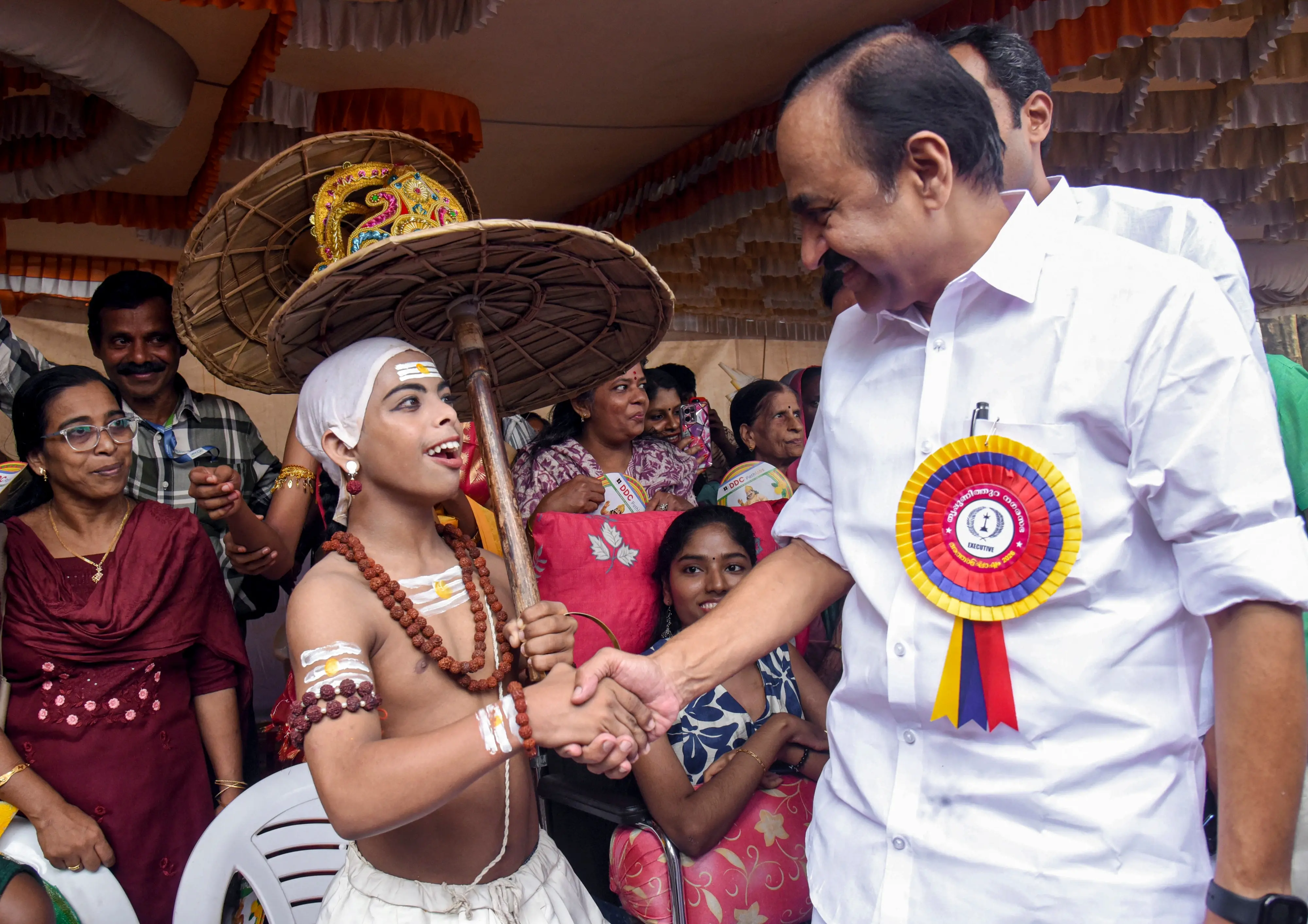 Kerala Chief Minister V D Satheesan interacts with differently-abled children dressed in various traditional costumes after the inauguration of the 'Athachamayam' procession at Tripunithura, in Kochi, Kerala.| Photo: PTI