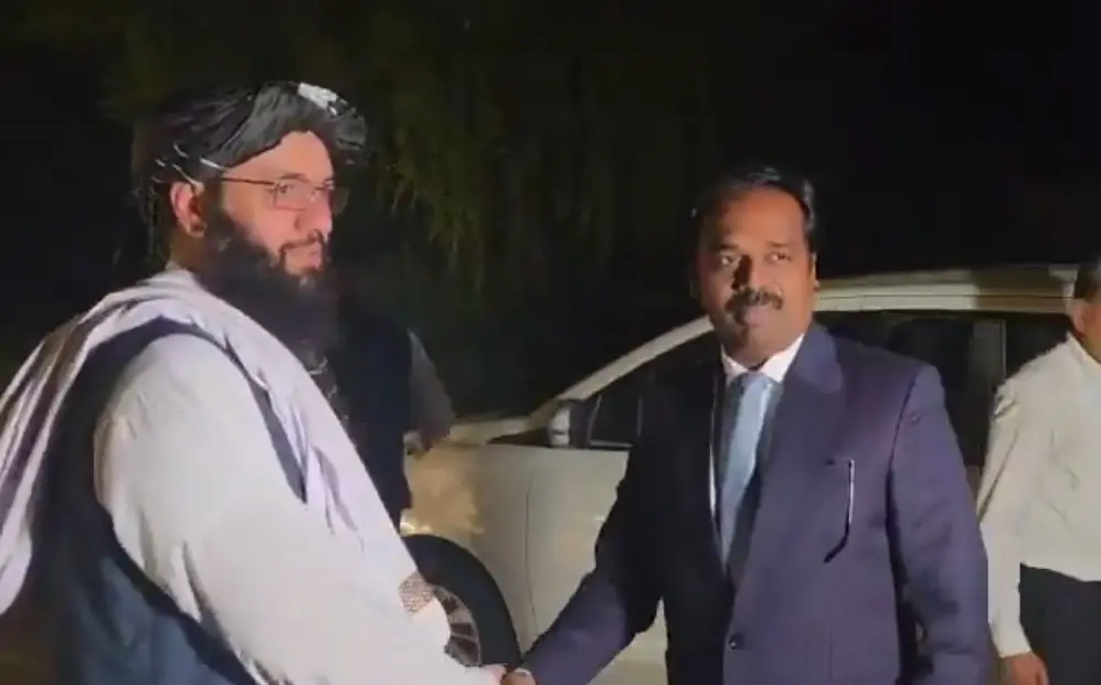 Chargé d'affaires Mufti Noor Ahmad Noor with Joint Secretary (Pakistan, Afghanistan and Iran) Anand Prakash at the embassy