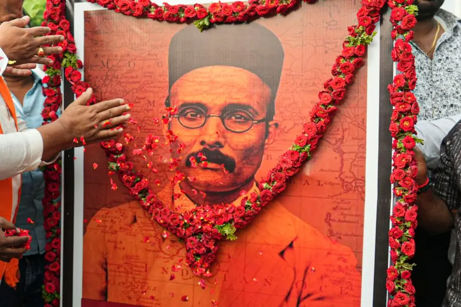 floral tribute at a poster of V.D. Savarkar