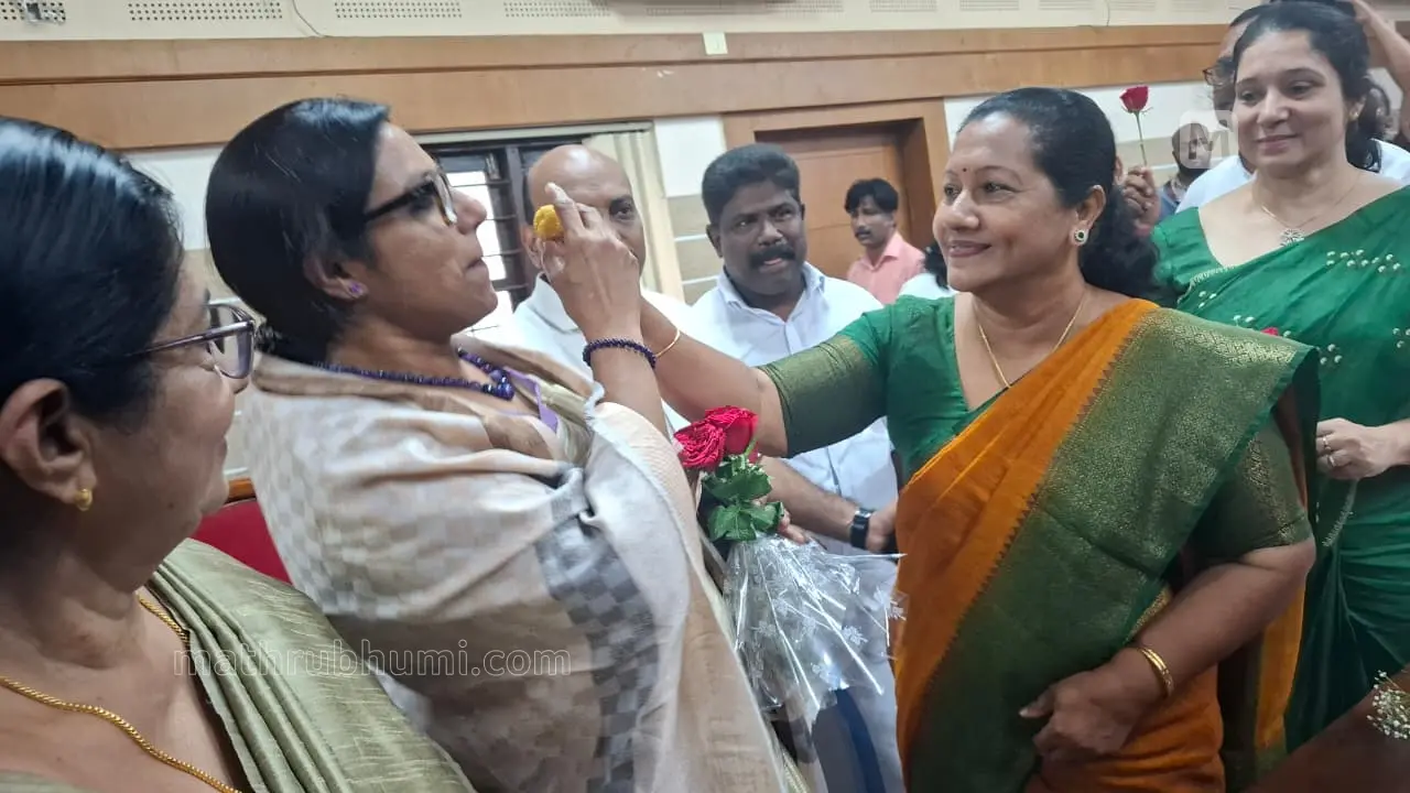 Maya Rahul distributing sweets after winning Pala Municipal Chairperson election