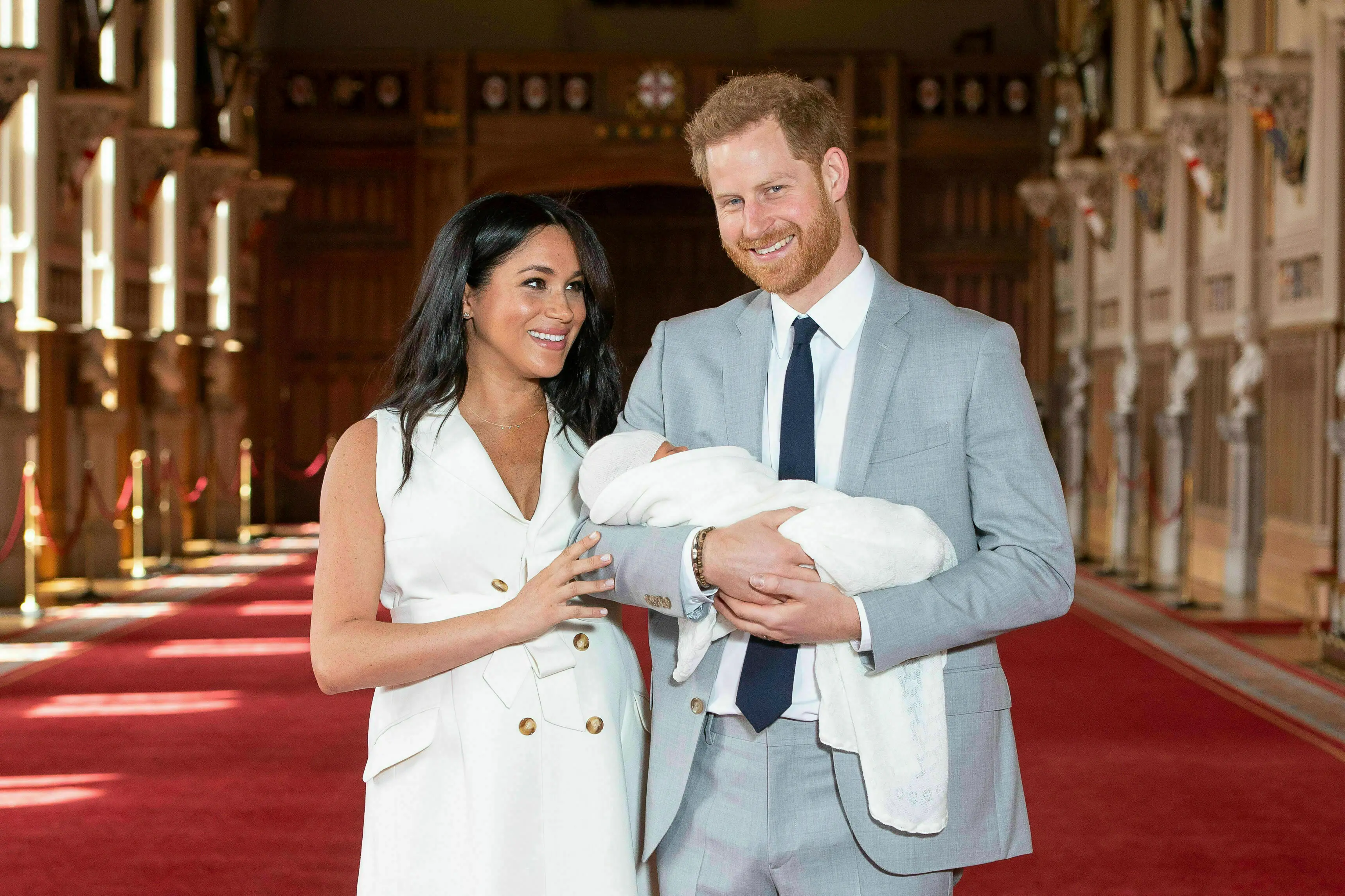 Britain's Prince Harry and Meghan, Duchess of Sussex, pose with their newborn son Archie Harrison Mountbatten-Windsor in St George's Hall at Windsor Castle, Windsor, south England.| File image: PTI
