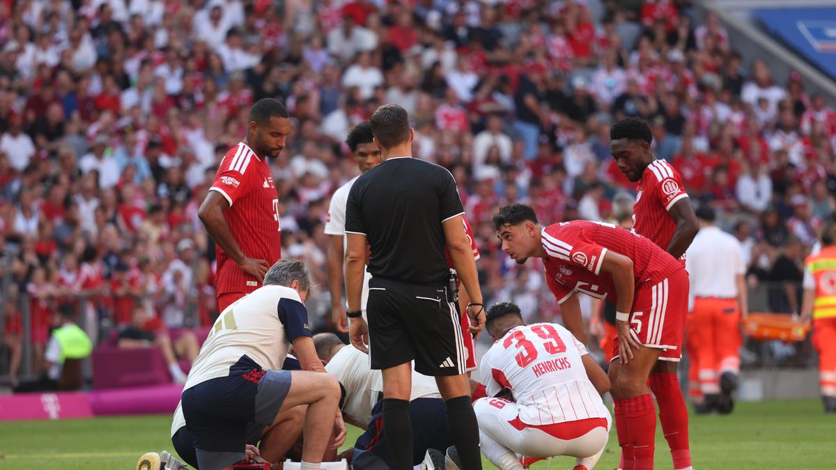 Munich's Jamal Musiala receives medical treatment during a pre-season soccer match between FC Bayern Munich and RB Leipzig in Munich, Germany, Saturday, Aug. 15, 2026. (Karl-Josef Hildenbrand/dpa via AP)