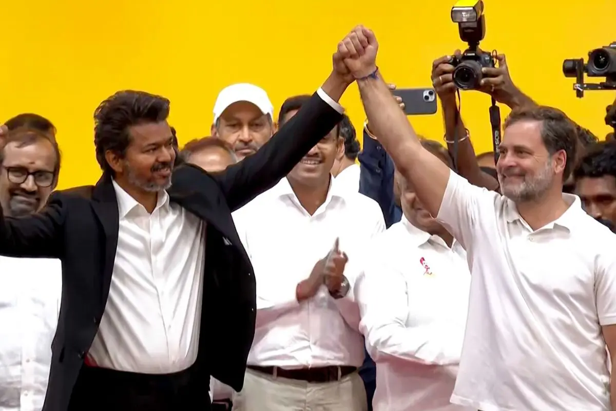 Tamilaga Vettri Kazhagam (TVK) chief C. Joseph Vijay and Lok Sabha Leader of Opposition and Congress MP Rahul Gandhi join hands during oath taking ceremony of chief minister of Tamil Nadu at the Jawaharlal Nehru Stadium, in Chennai on Sunday. (@RahulGandhi X/ANI Video Grab)