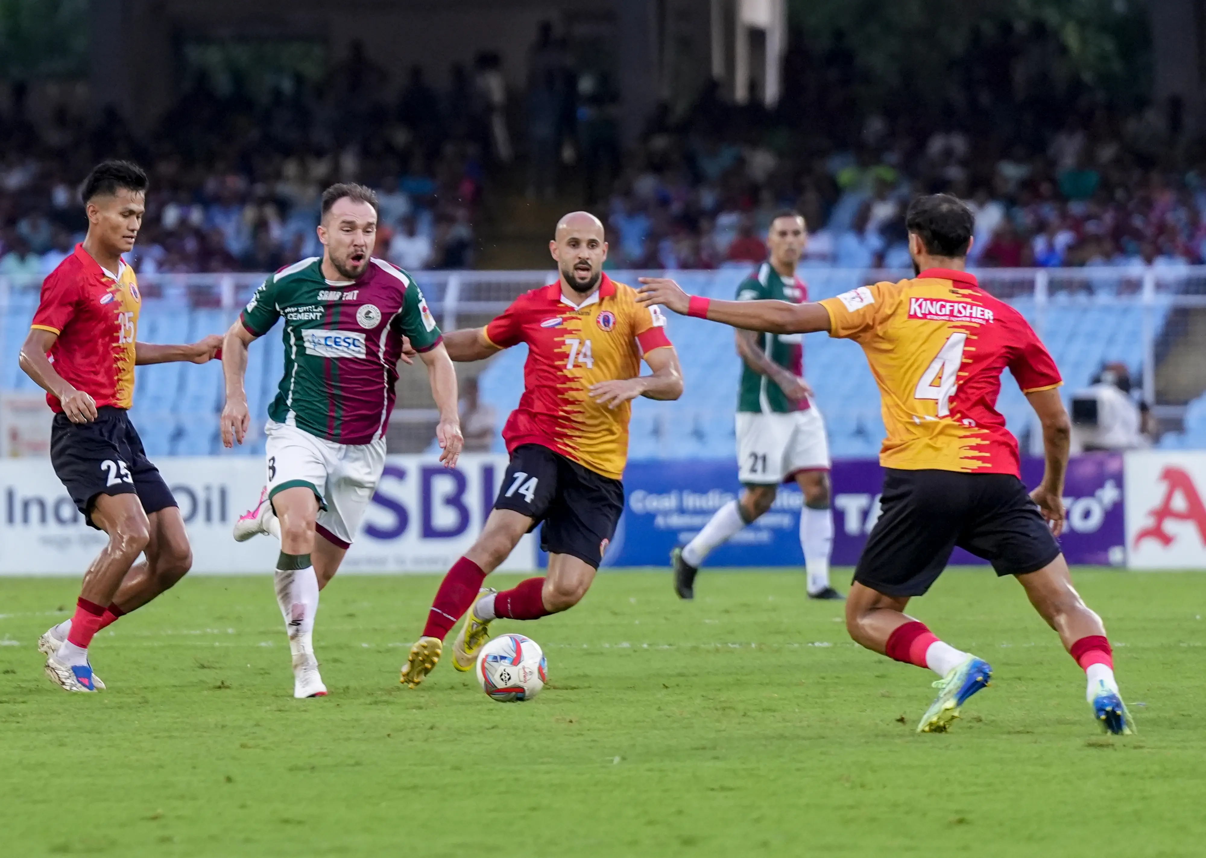 Mohun Bagan Super Giant's Samir Zeljkovic, 8, vies for the ball with East Bengal FC's Anwar Ali, 4, Mohamad Basim Rashid, 74, and Thounaojam Jeakson Singh, 25, during the Durand Cup 2026 Final football match between East Bengal FC and Mohun Bagan Super Giant, in Kolkata, West Bengal | PTI