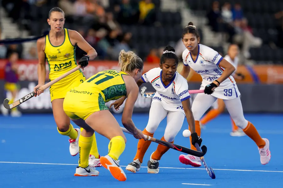 Australia's Alice Arnott (centre-L) fights for the ball with India's Sunelita Toppo (centre-R) during the 2026 FIH Women's Hockey World Cup group stage match Australia and India at the Wagener Stadium in Amstelveen