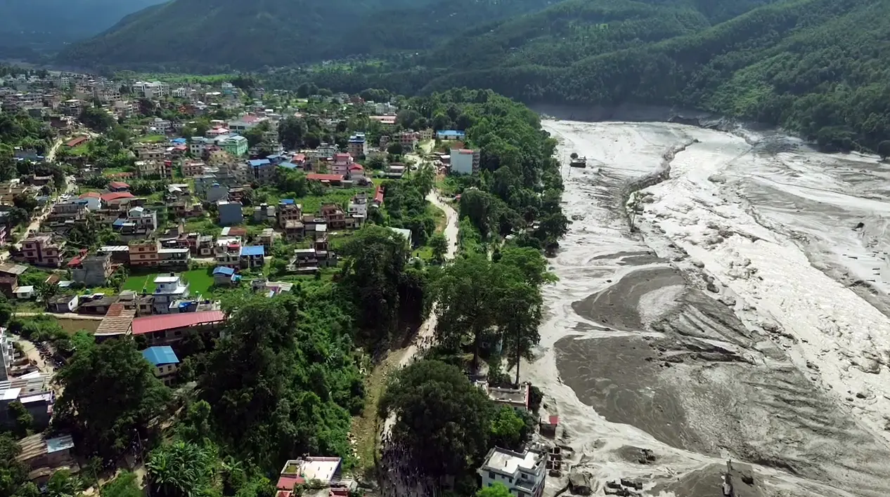 An aerial view of a mud-laden flash flood following an outburst in the Bhotekoshi River
