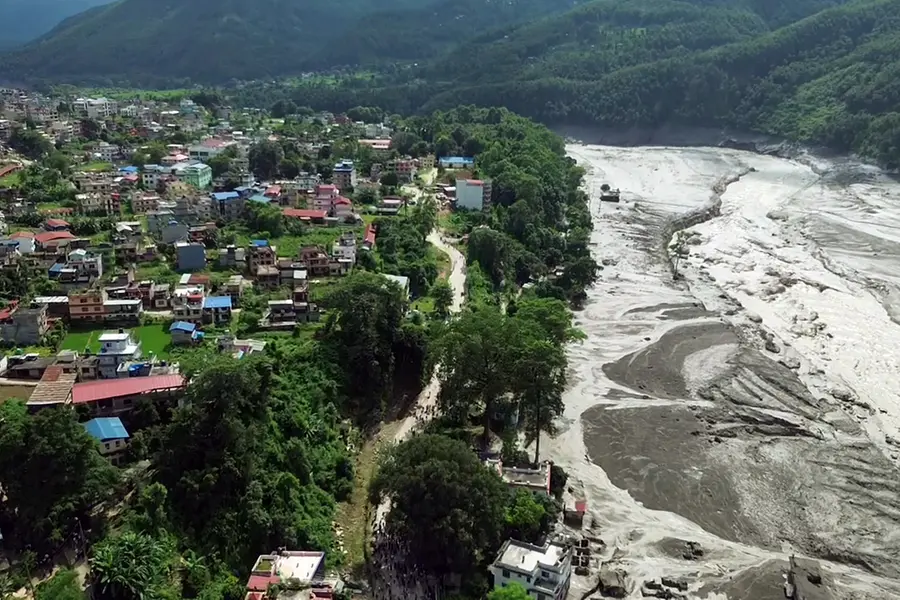 An aerial view of a mud-laden flash flood following an outburst in the Bhotekoshi River