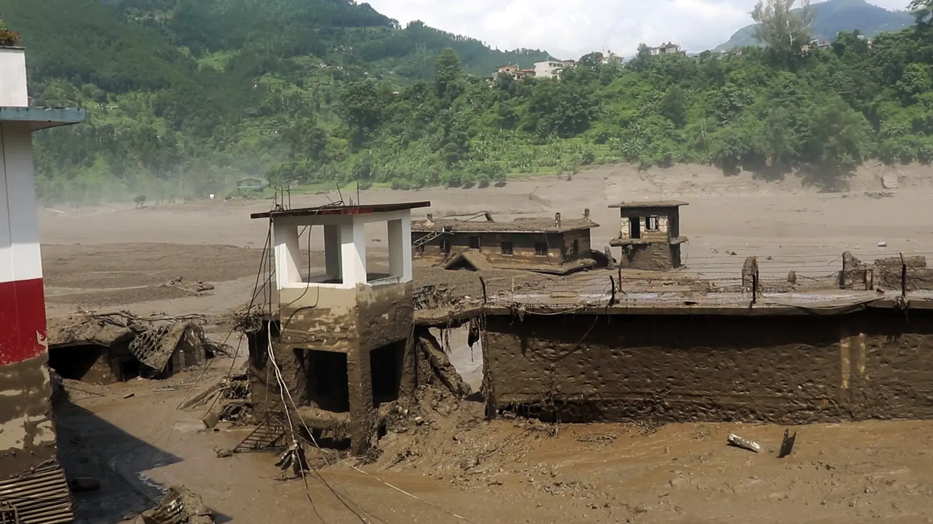 A residential area devastated by mud-laden floodwaters following a flash flood caused by an outburst in the Bhotekoshi River