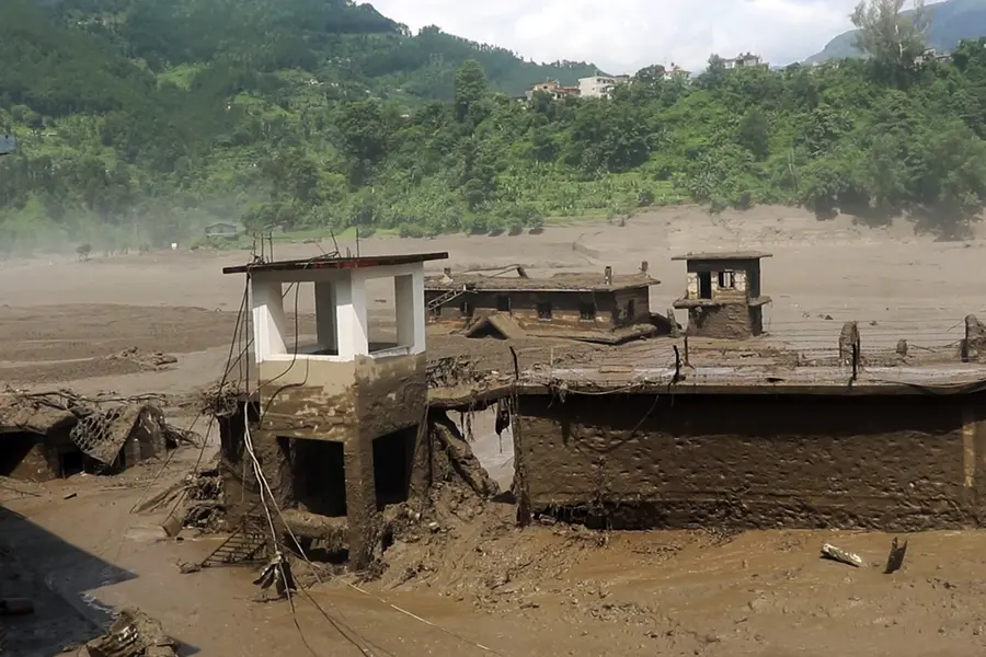 A residential area devastated by mud-laden floodwaters following a flash flood caused by an outburst in the Bhotekoshi River