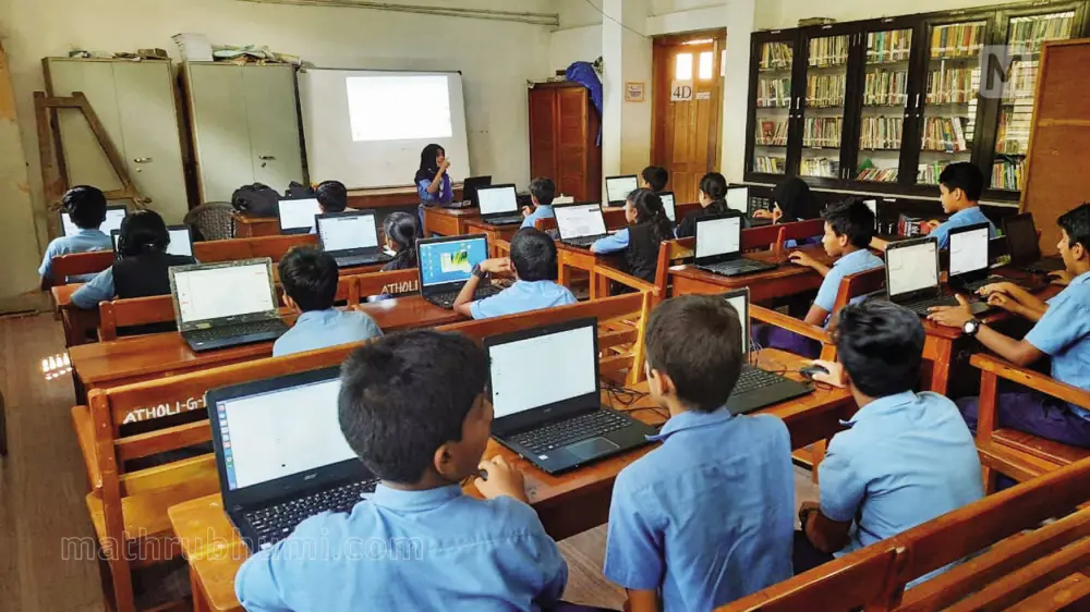 Veloor GMUP school students learning from a hi tech classroom. Kerala schools are fast becoming digital with hi-tech classrooms equipped with advanced gadgets, including laptops and multi-media projectors | Mathrubhumi