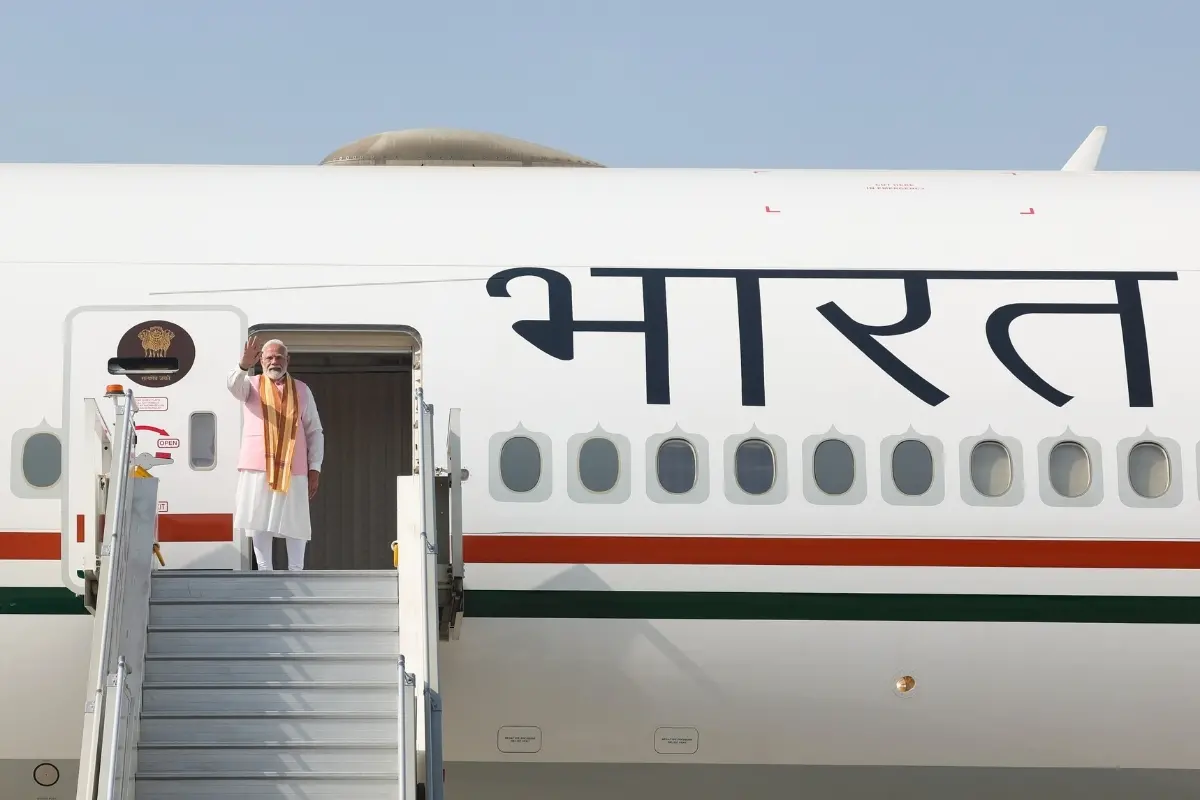 Prime Minister Narendra Modi gestures as he boards the flight for Tashkent, Uzbekistan, in New Delhi | Photo: PTI