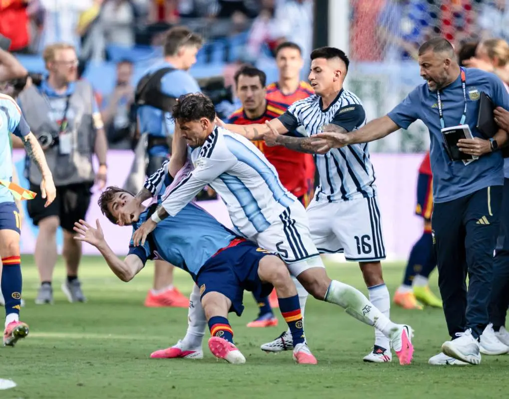 Argentina's Leandro Paredes (5) sends Spain's Gavi (9) to the ground during a post-match brawl following the World Cup final in East Rutherford, New Jersey. | Photo: Getty Images