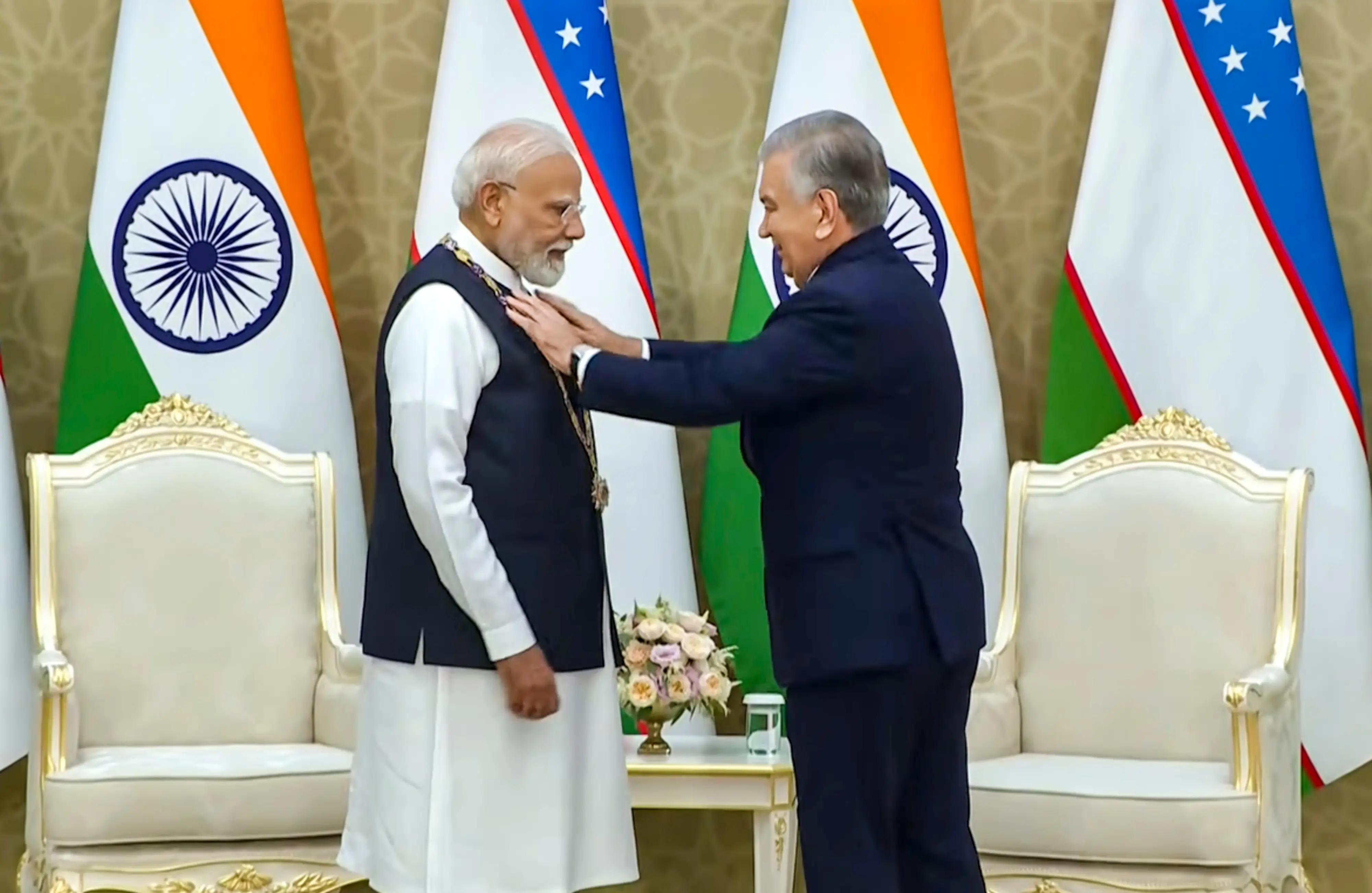 Prime Minister Narendra Modi being conferred with Uzbekistan's prestigious 'Oliy Darajali Do'stlik' by Uzbekistan President Shavkat Mirziyoyev, at the Kuksaroy Presidential Palace in Tashkent, Uzbekistan.| Photo: PTI