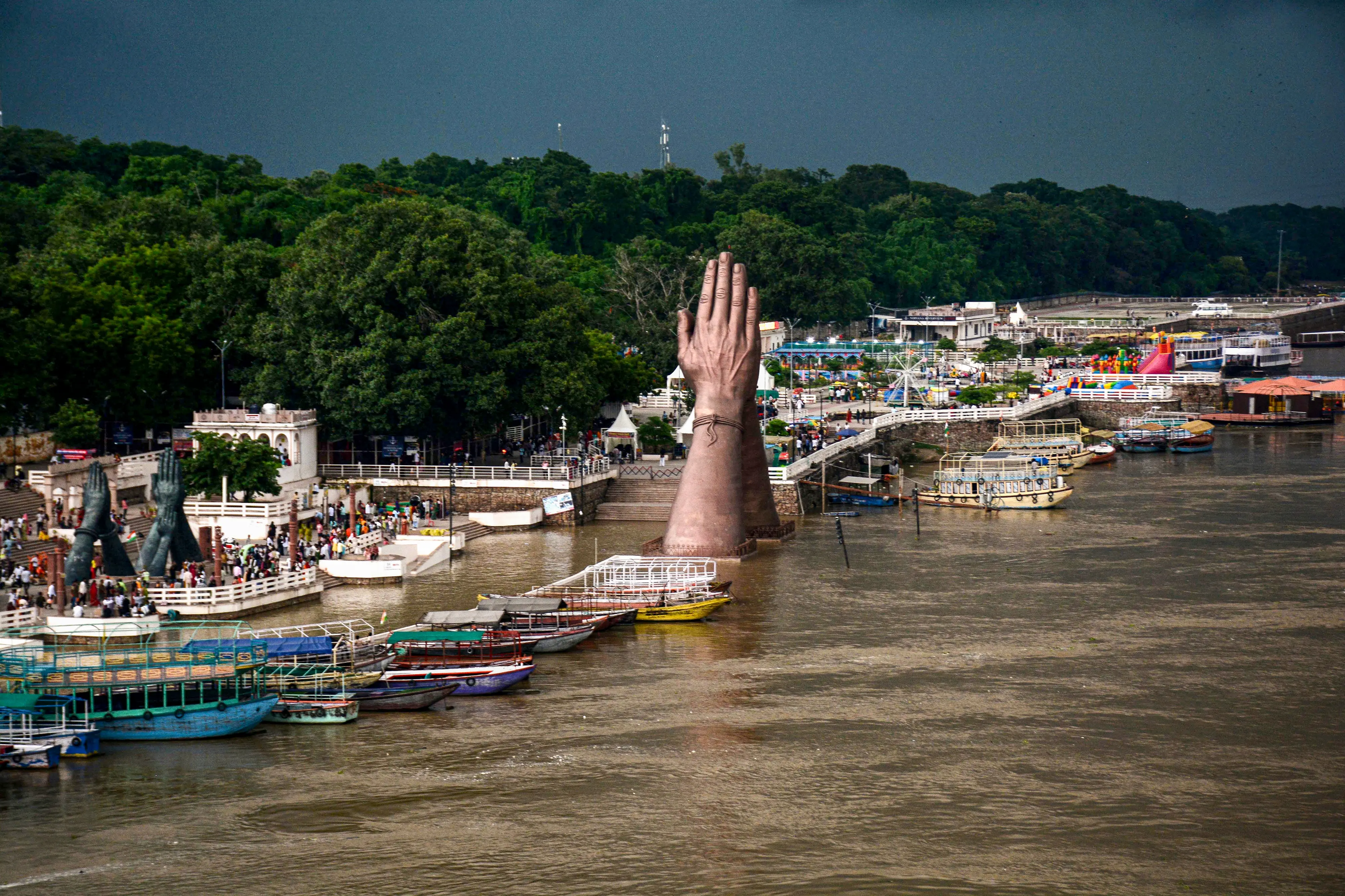 A swollen Ganga river at Namo Ghat as the water level rises following heavy rainfall, in Varanasi, Uttar Pradesh.| Photo: PTI