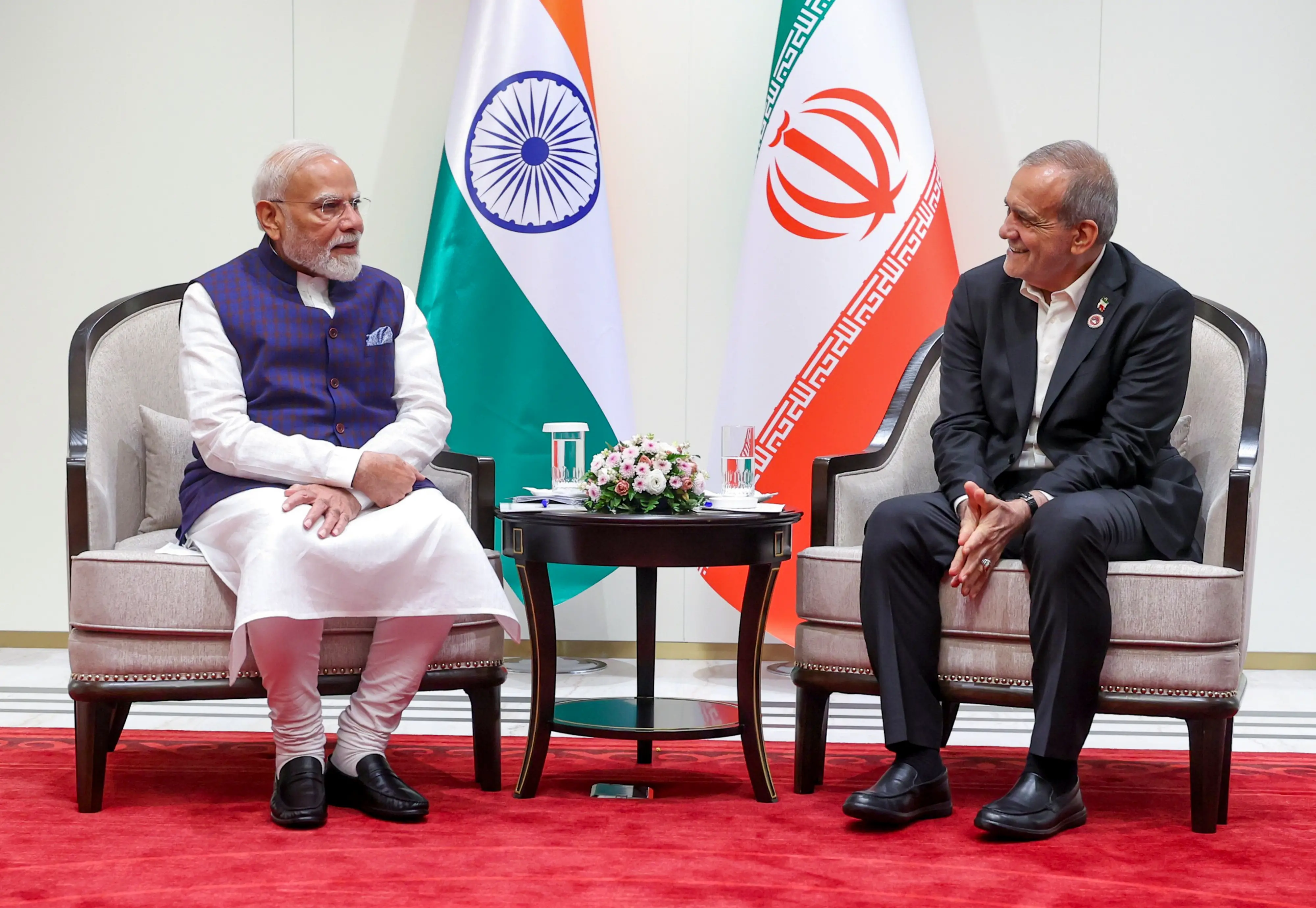 Prime Minister Narendra Modi shakes hands with the President of Iran, Masoud Pezeshkian, during their bilateral meeting on the sidelines of the 26th Shanghai Cooperation Organisation (SCO) Summit, in Bishkek, Kyrgyzstan.| Photo: PTI