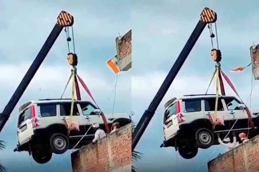 വാഹനം മോഷണം പോകുമോയെന്ന് ഭയം; ക്രെയിൻ ഉപയോഗിച്ച് സ്കോർപിയോ വീടിന് മുകളിൽ കയറ്റി വാഹന ഉടമ | Video