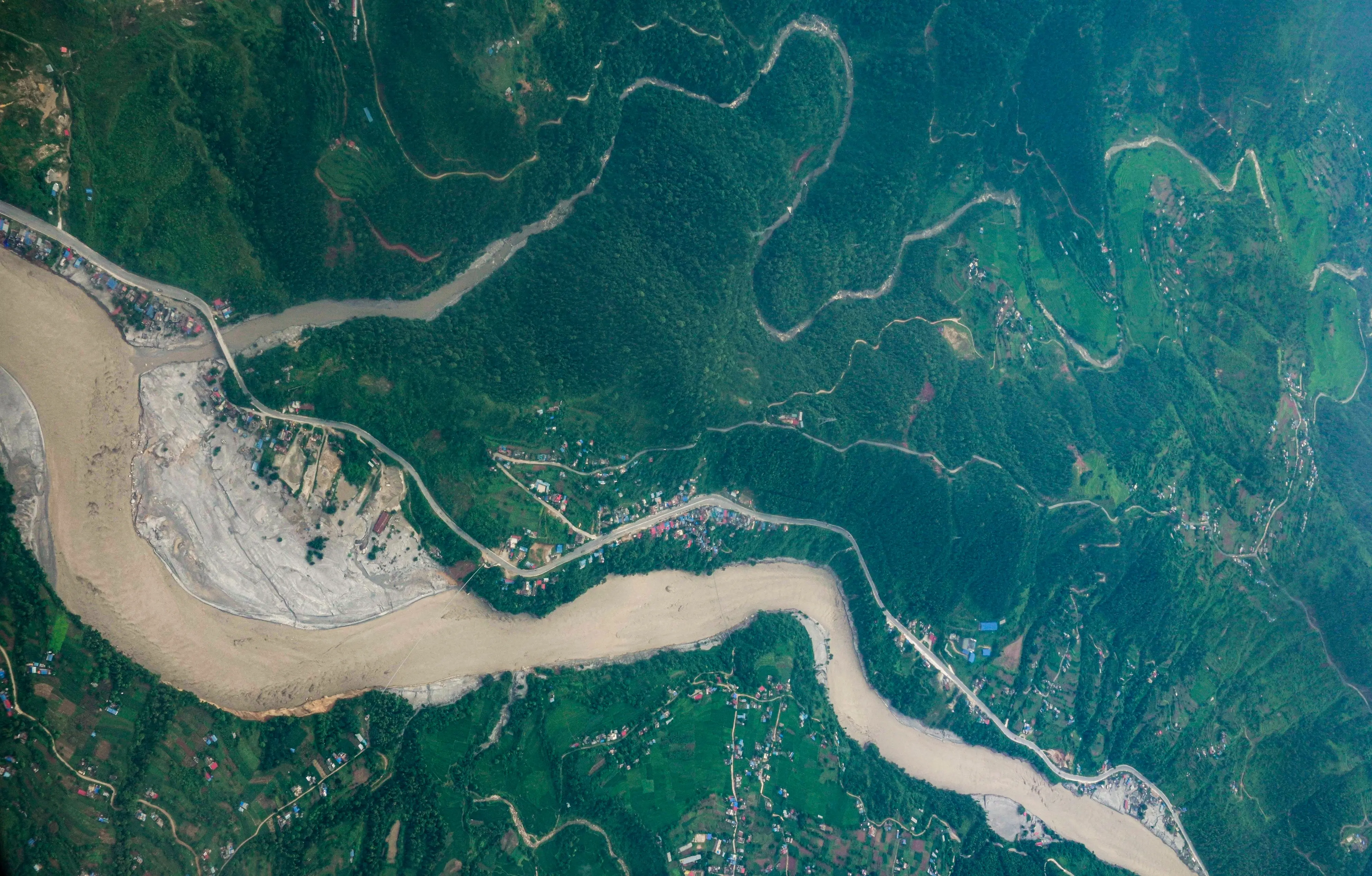 An aerial view of the swollen Trishuli River in the aftermath of the flash floods, near Chitwan, Nepal.| Photo: PTI